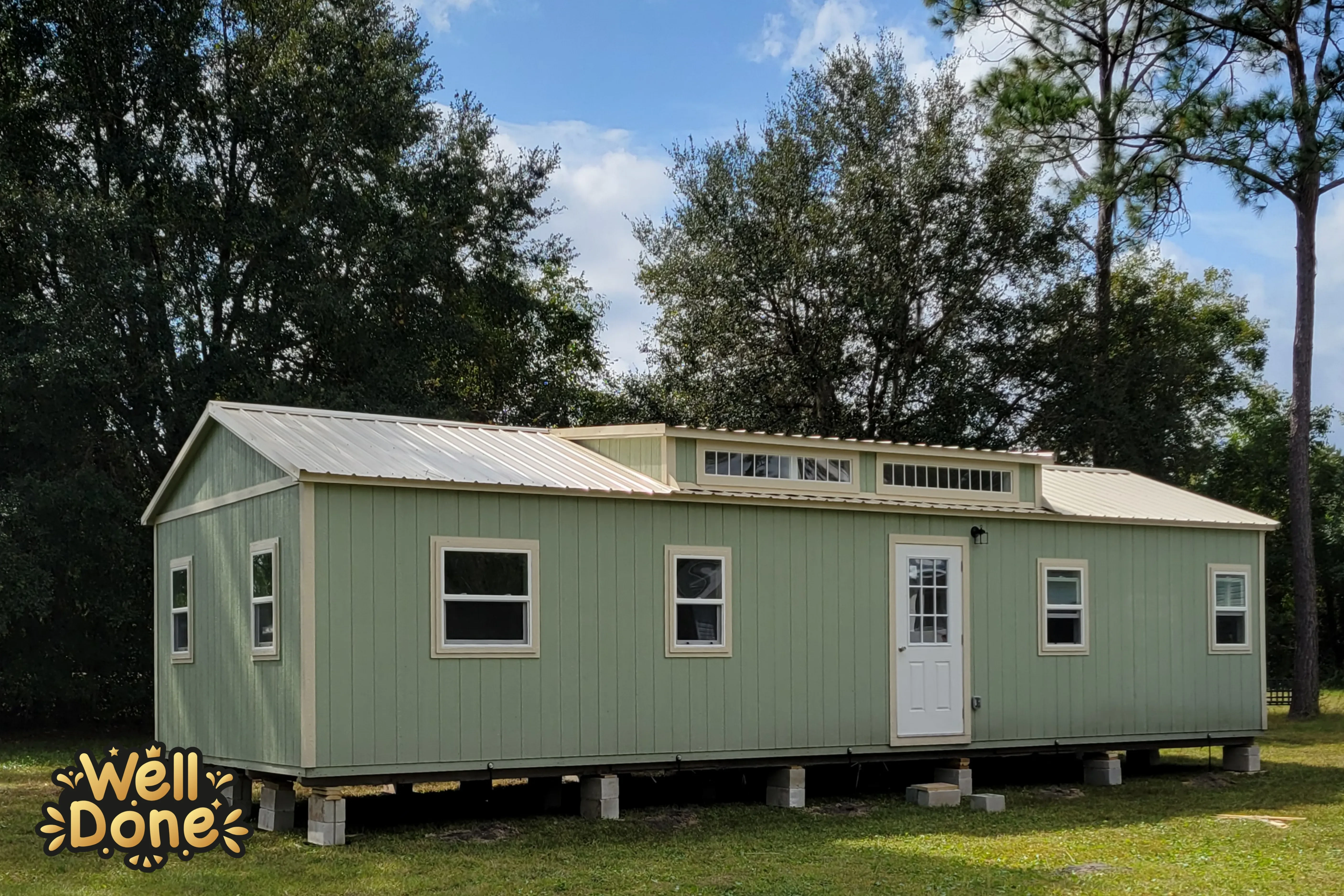 Big custom shed with a dormer and lots of windows