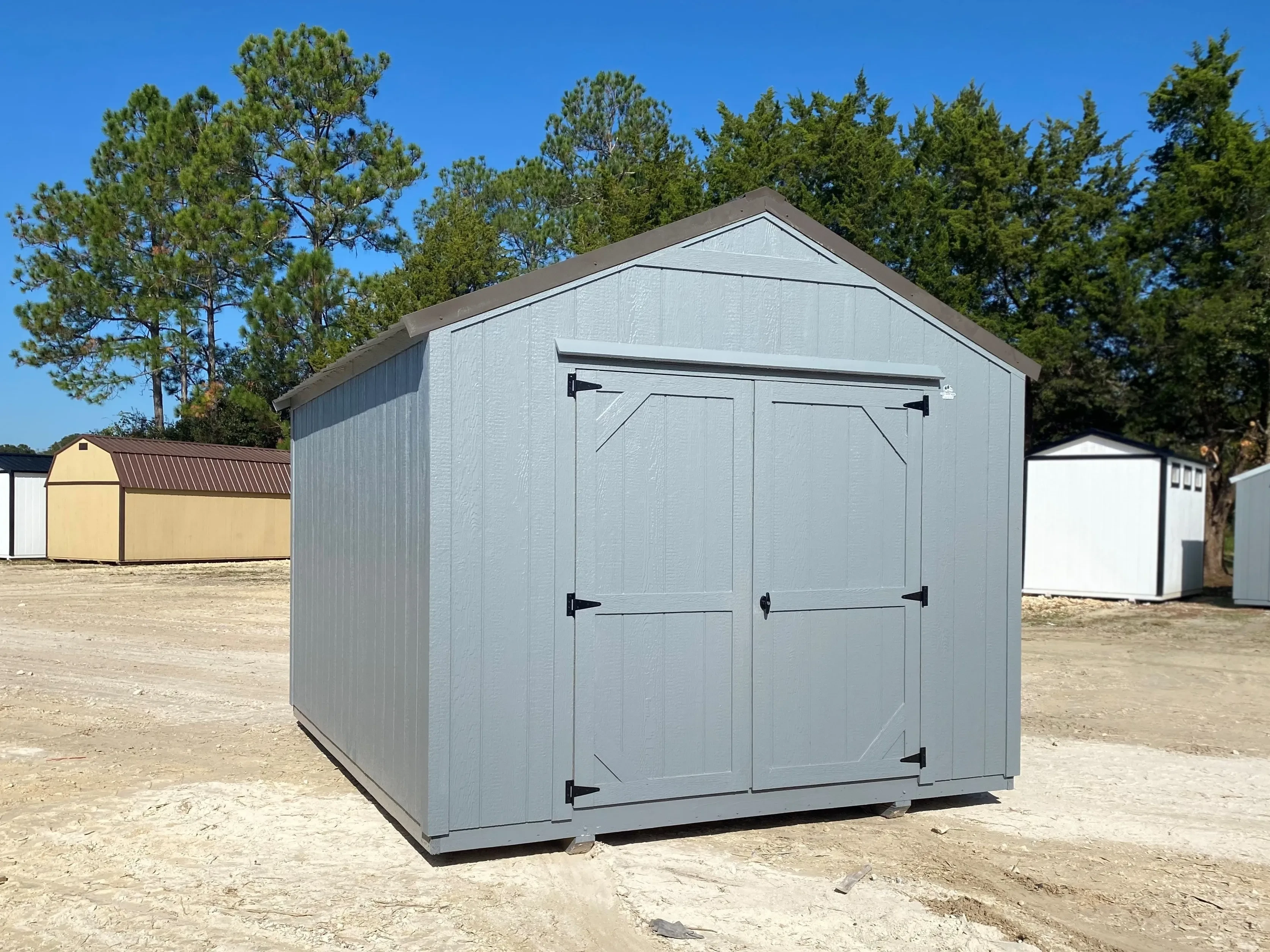 grey economy wood garden shed with a bronze roof