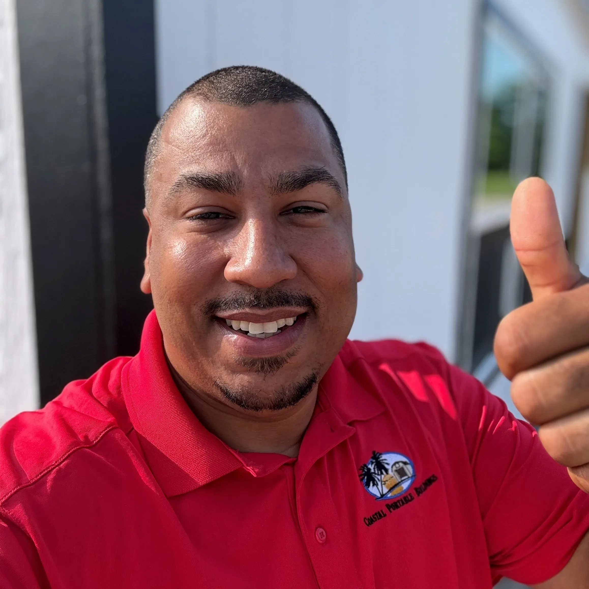 Happy sales rep at home sales lot