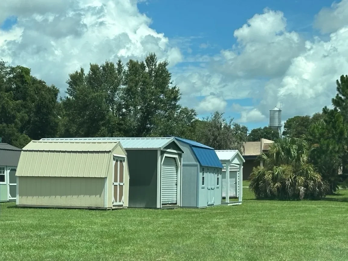 Row of sheds on display at the shed sales lot in Williston, FL
