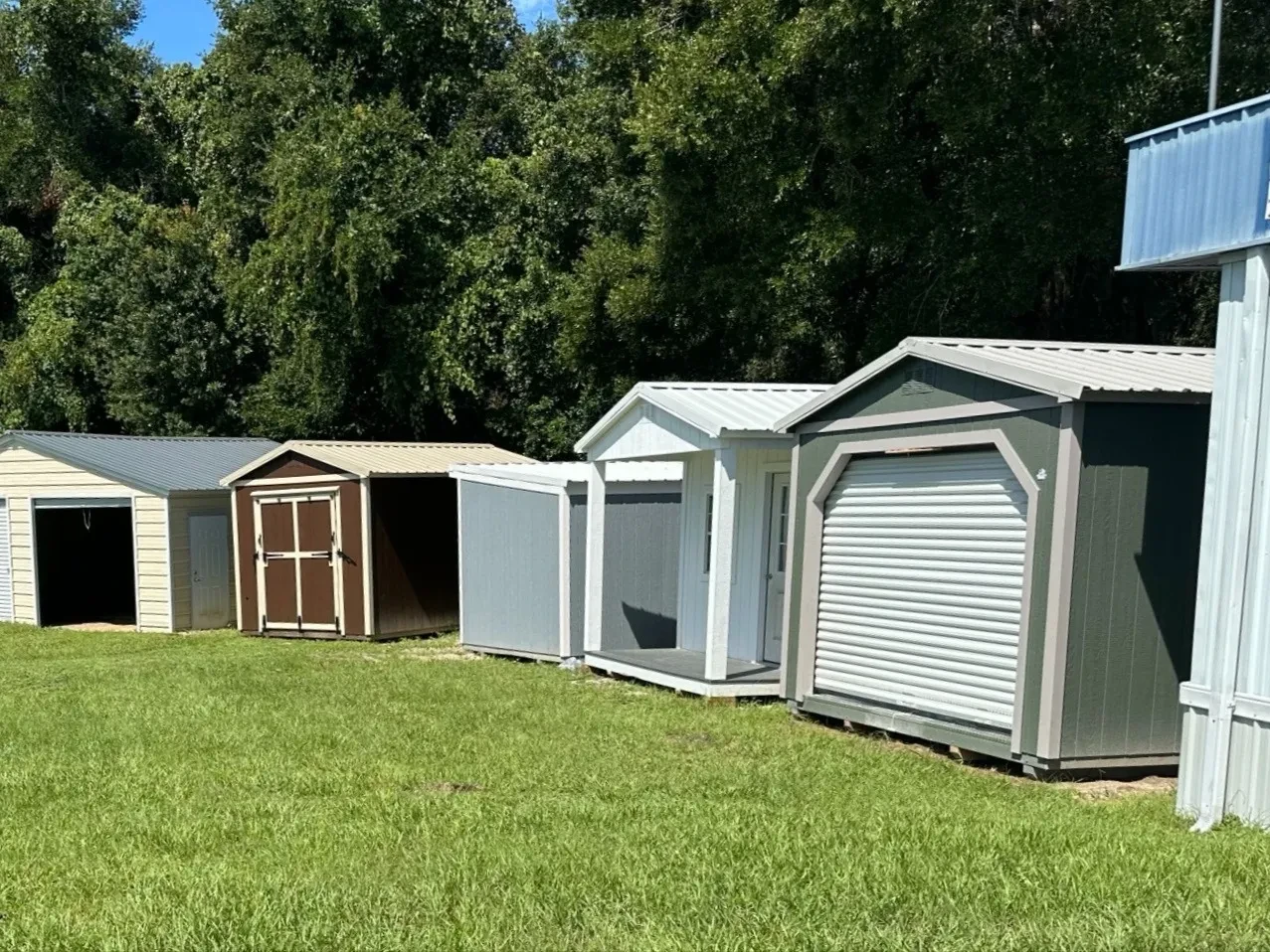 Row of sheds on display at the shed sales lot in Ocala, FL
