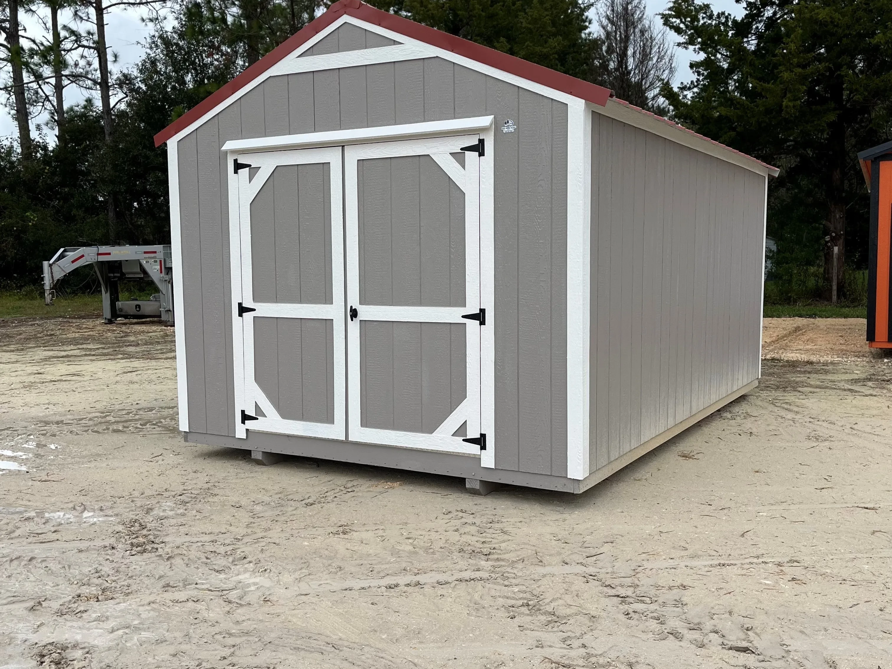 Outside of a 10x16 garden shed economy with double wood doors