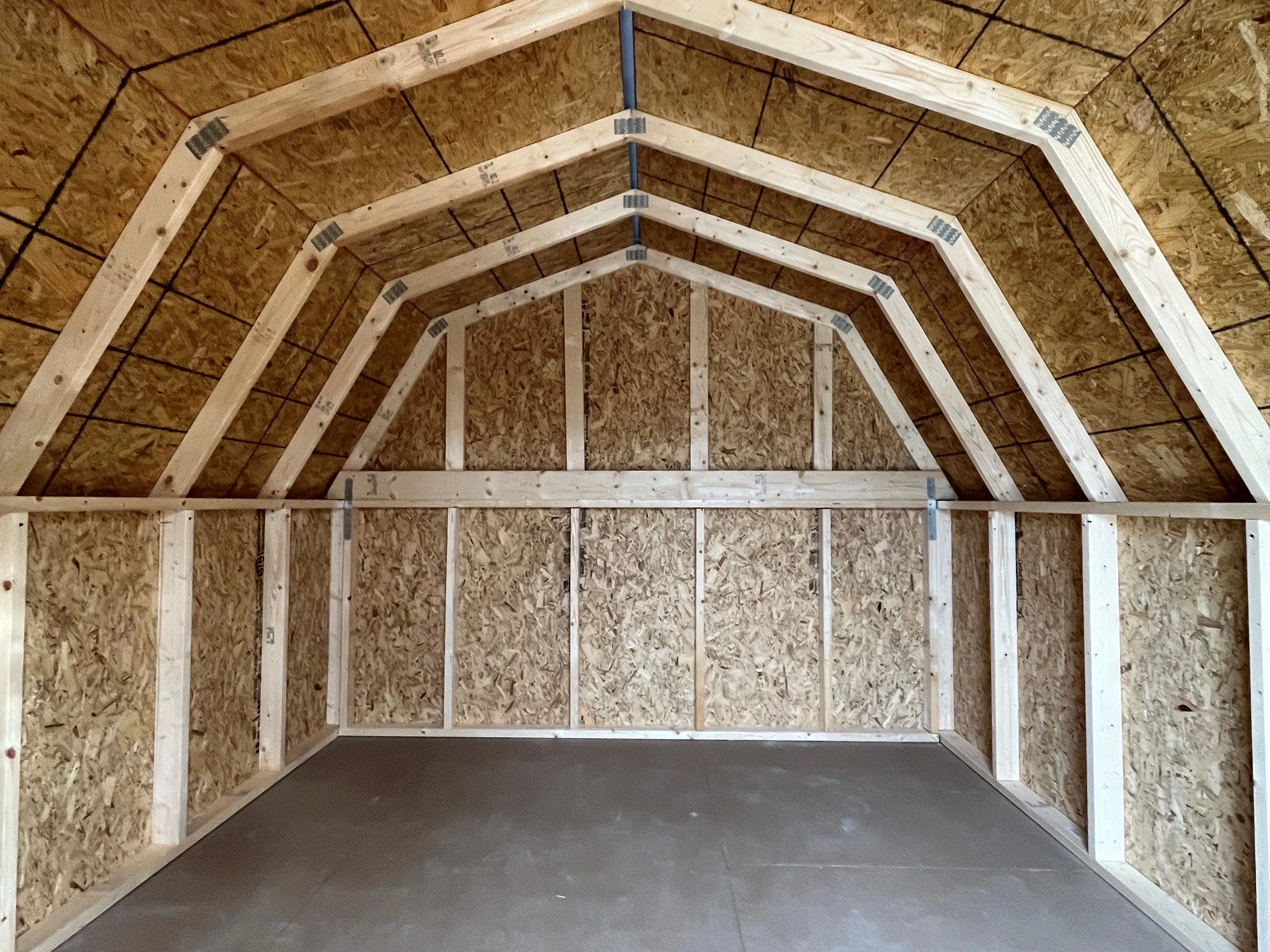 Interior of a barn economy through the double wood doors