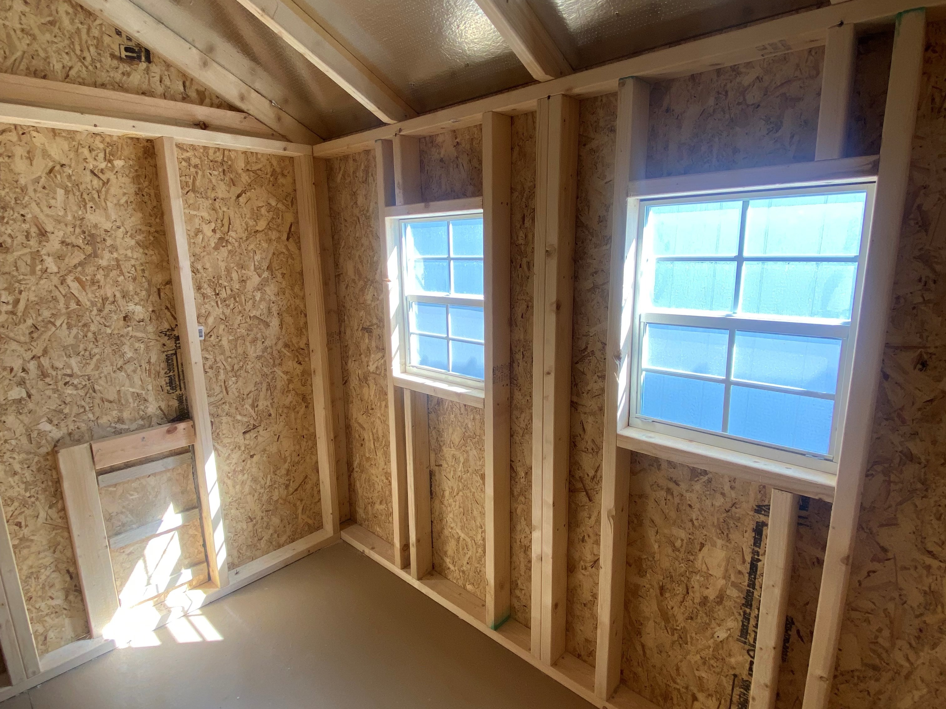 Interior of an 8x8 chicken coop showing windows
