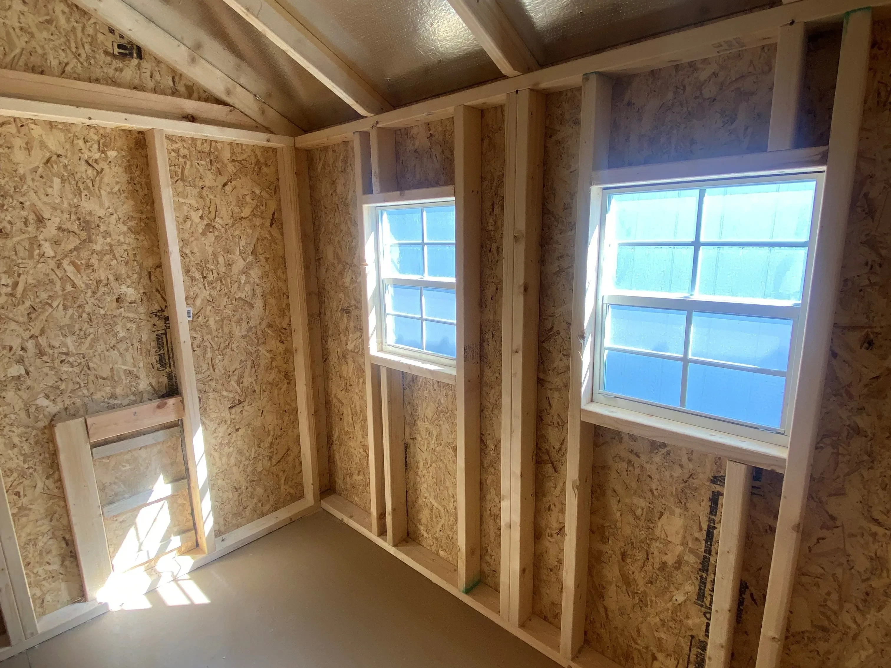 Interior of an 8x8 chicken coop showing windows