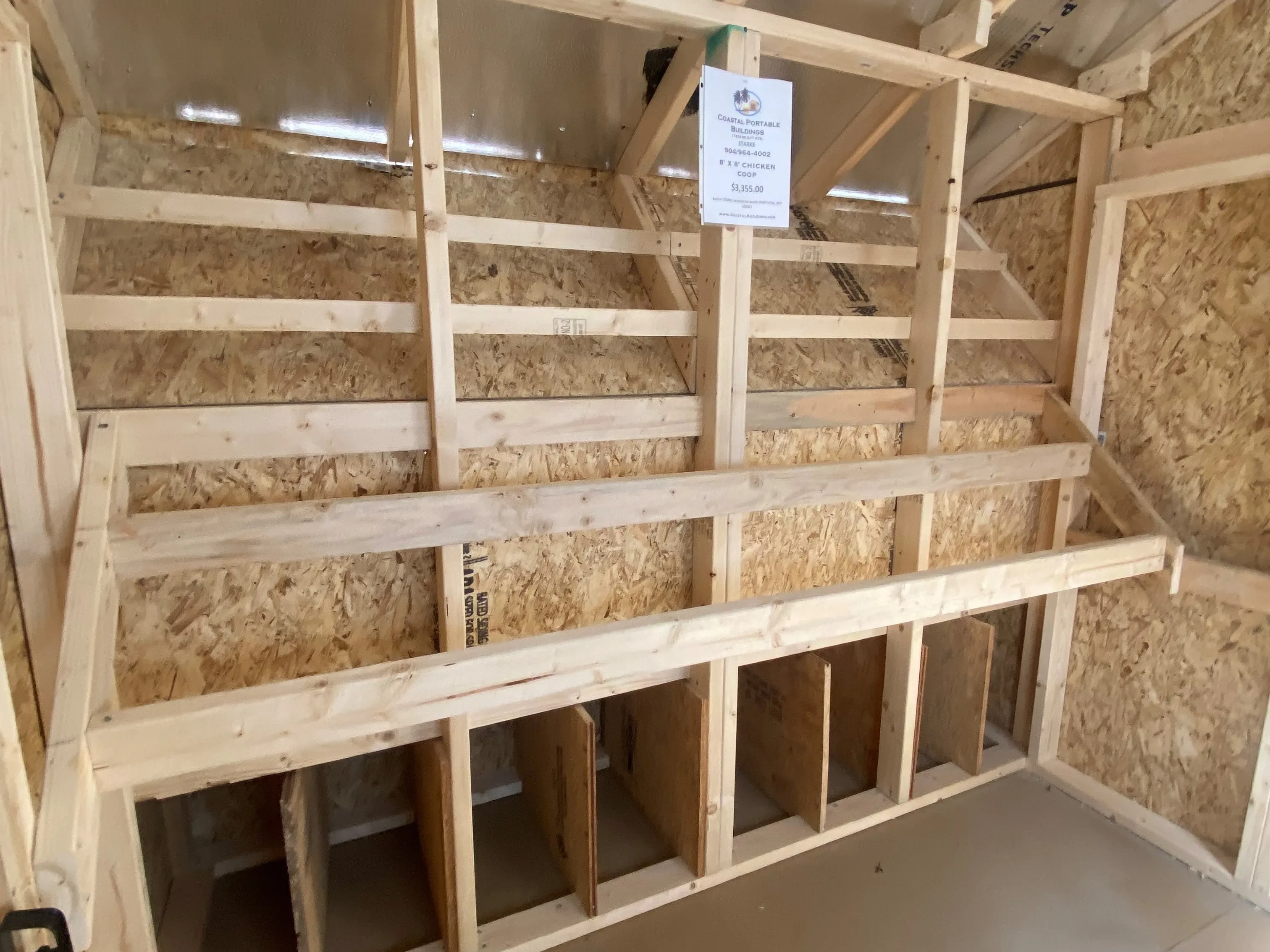 interior of layer boxes and showing roosting bars