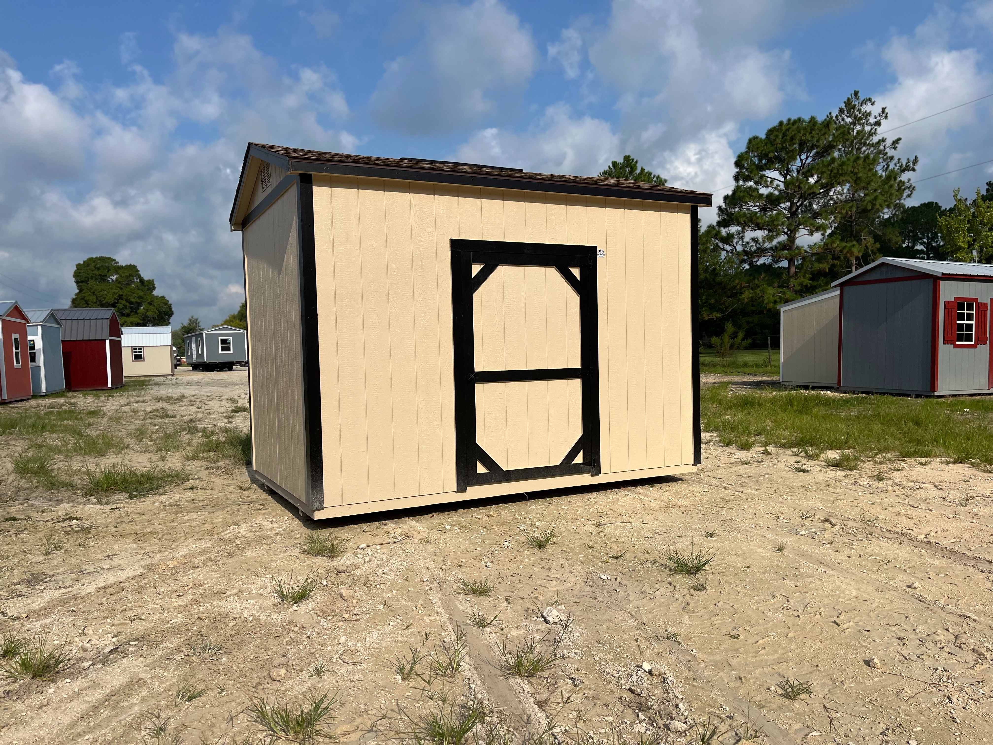 Exterior of an 8x12 side garden shed with a single wood door