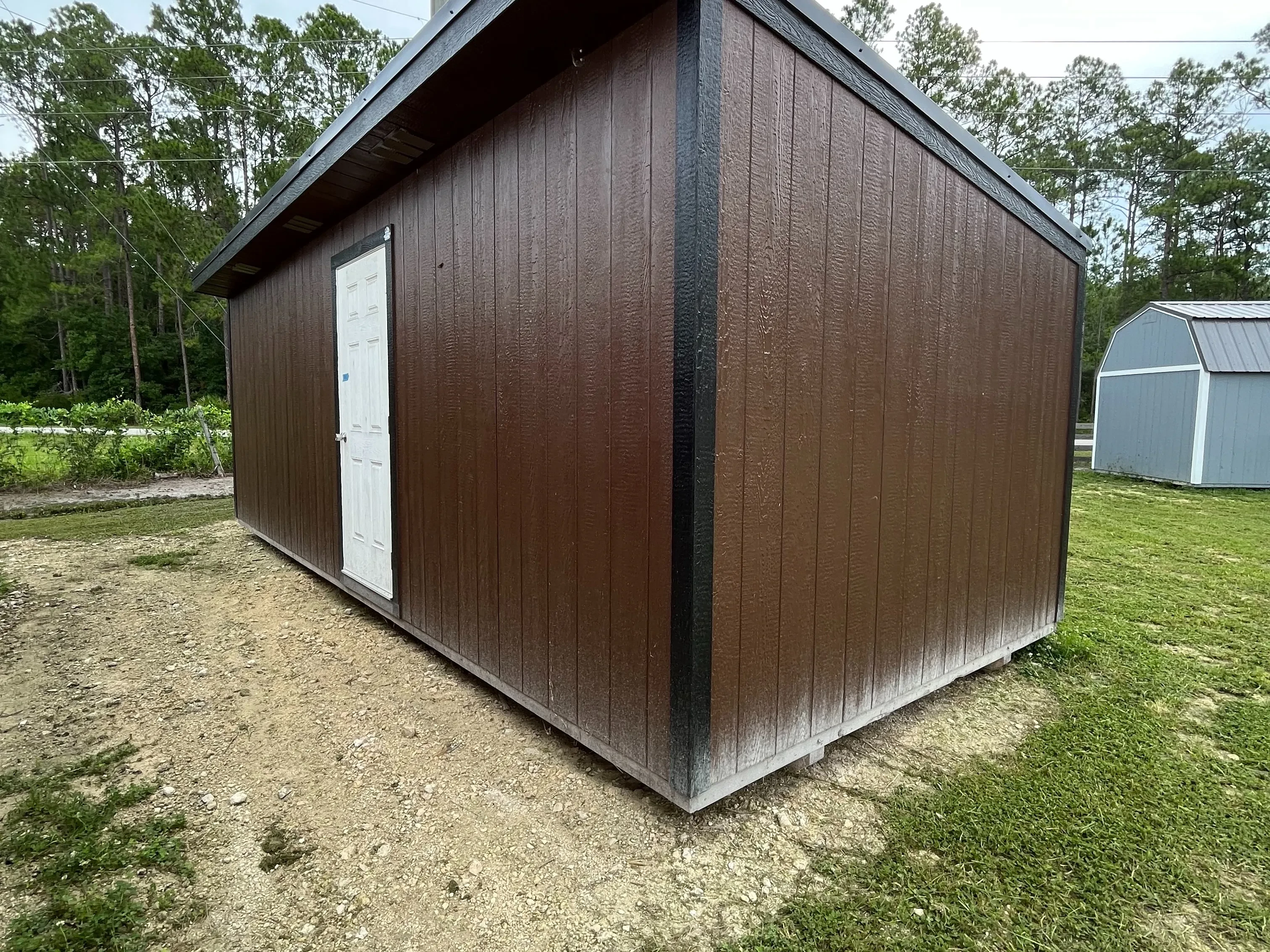 Exterior of a 10x24 dark brown urban with a walk-in door