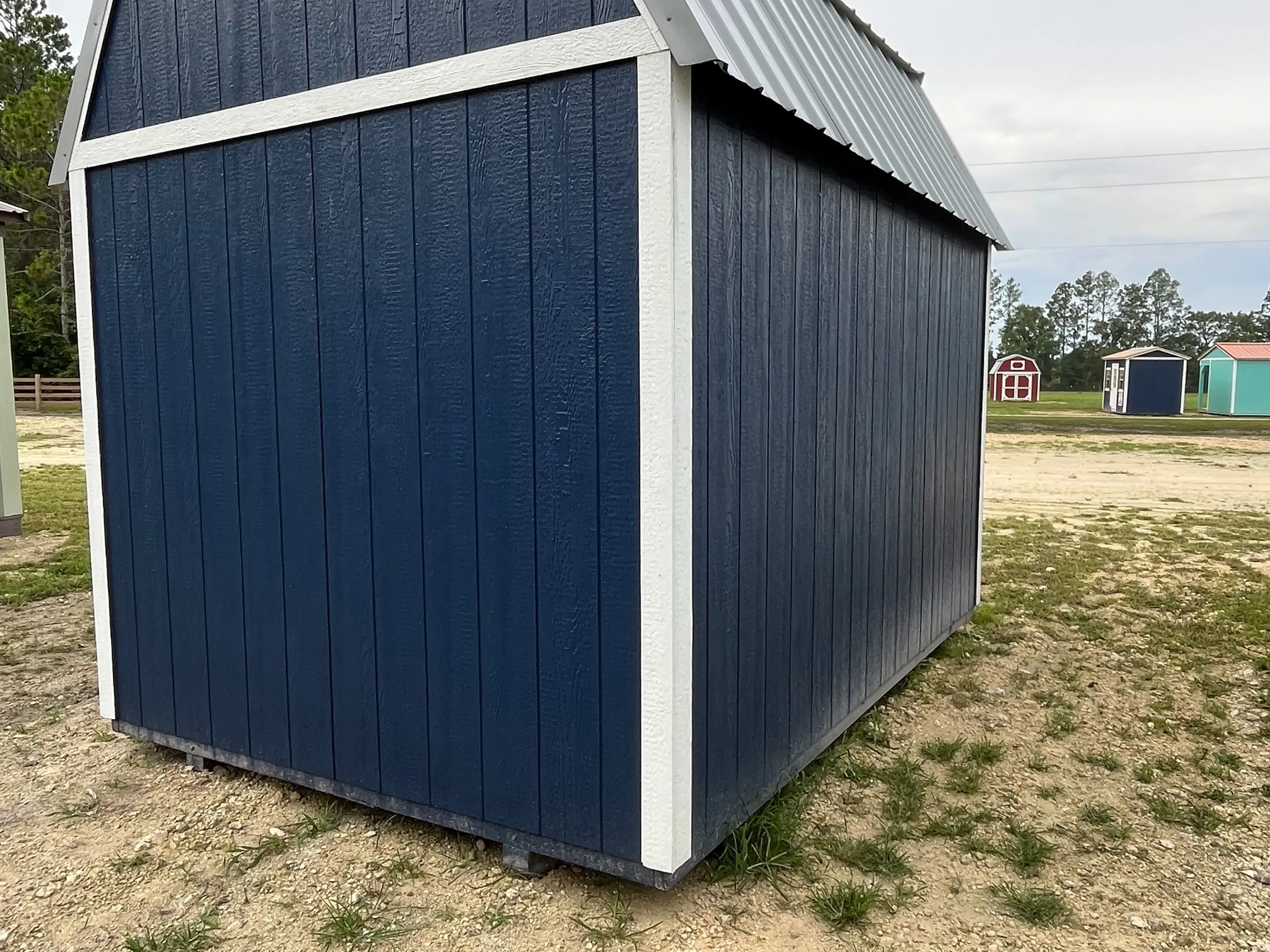 Exterior rear view of the dark blue 8x12 lofted barn