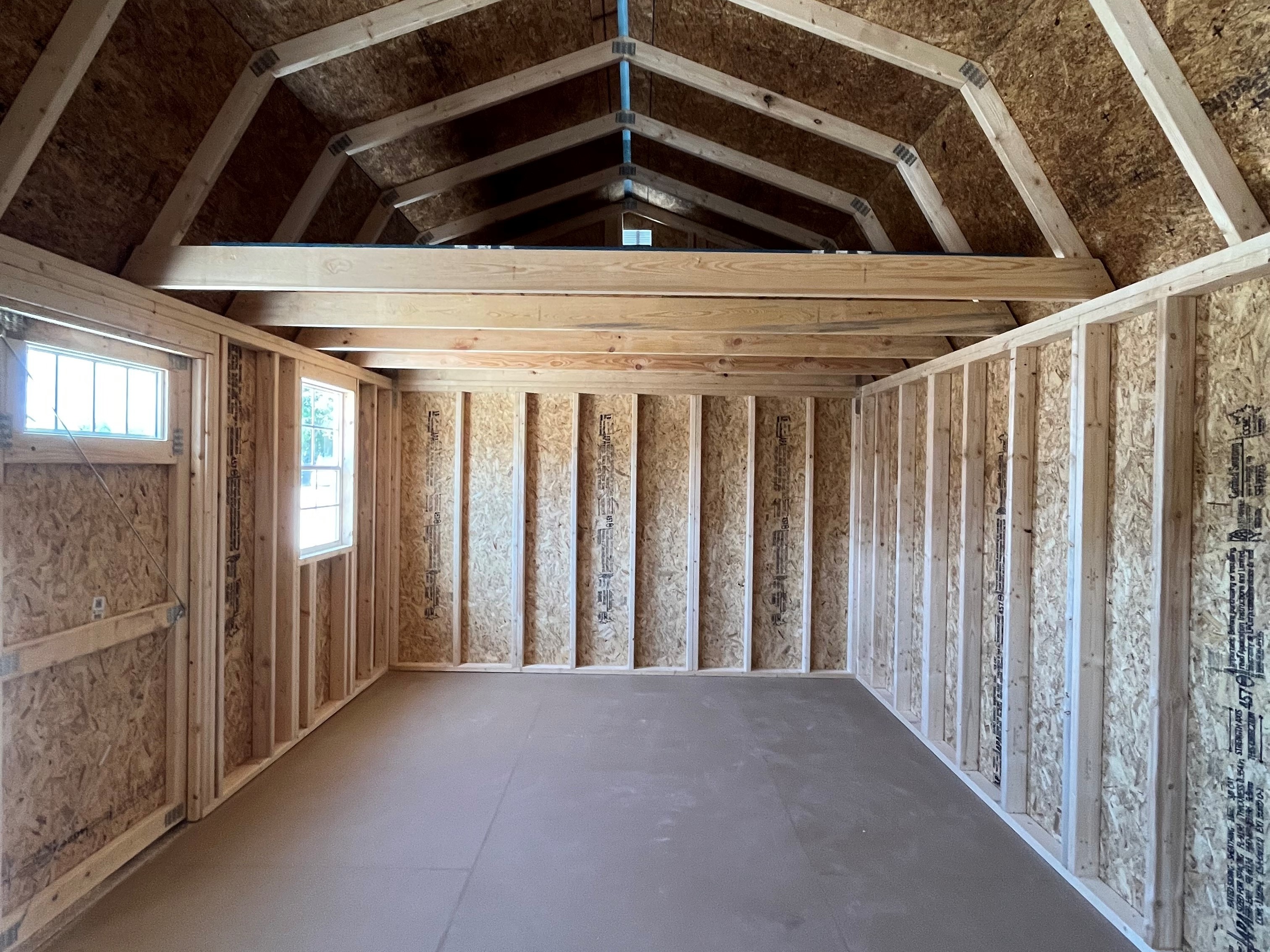 Interior of a 12x20 side lofted barn showing 8' loft in the end 