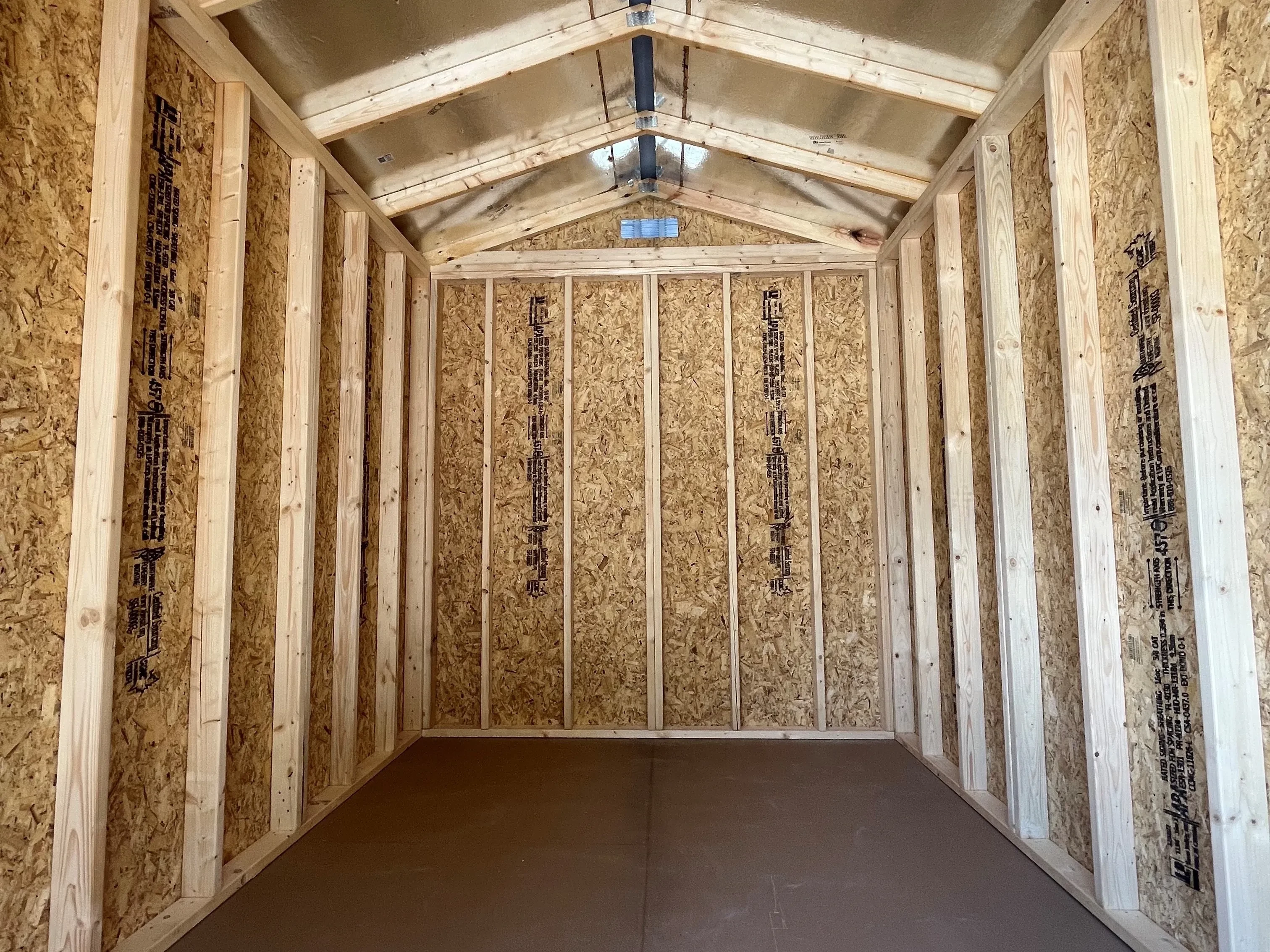 Interior of an 8x12 garden shed showing the radiant barrier in roof