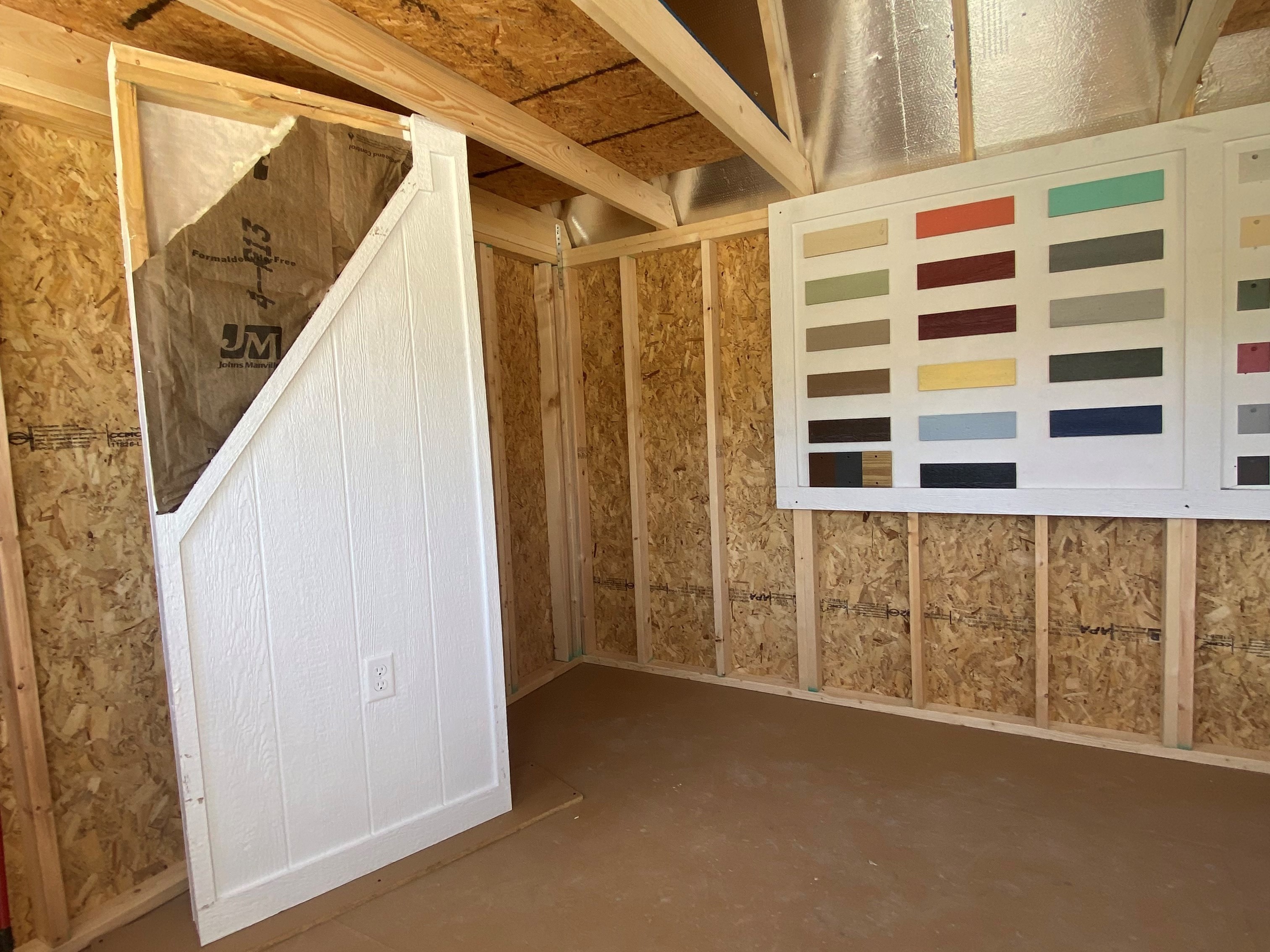 Interior of 10x12 side lofted barn showing radiant barrier in roof