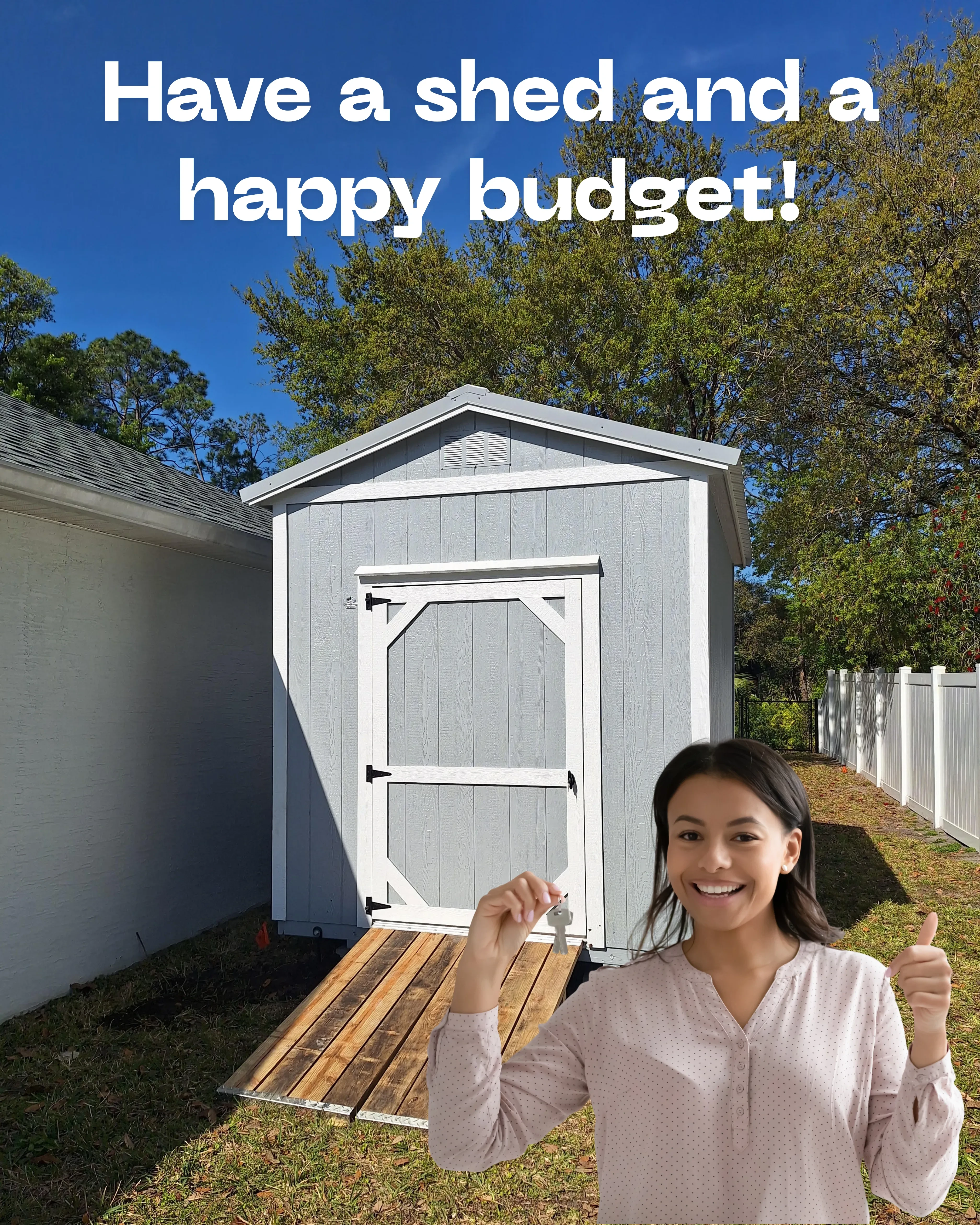 A shed with a ramp with a smiling woman standing in front of it holding the keys and giving a thumbs up