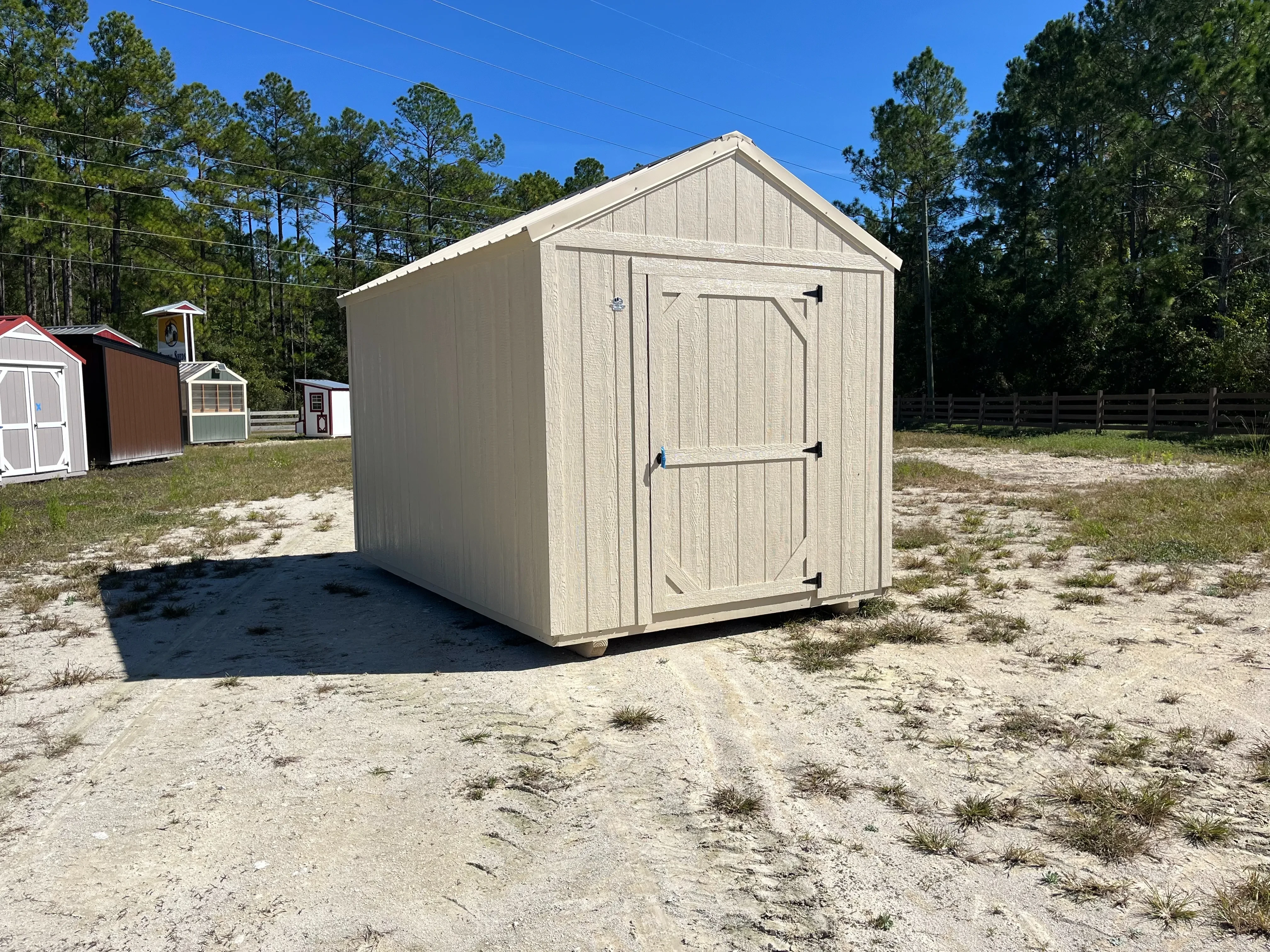 Exterior photo of an almond 8x12 Garden Shed Economy showing left side and front