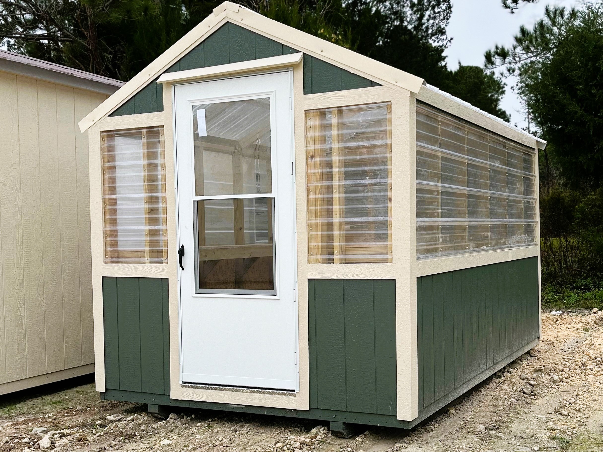 Exterior of an 8x12 Green house with a walk-in door