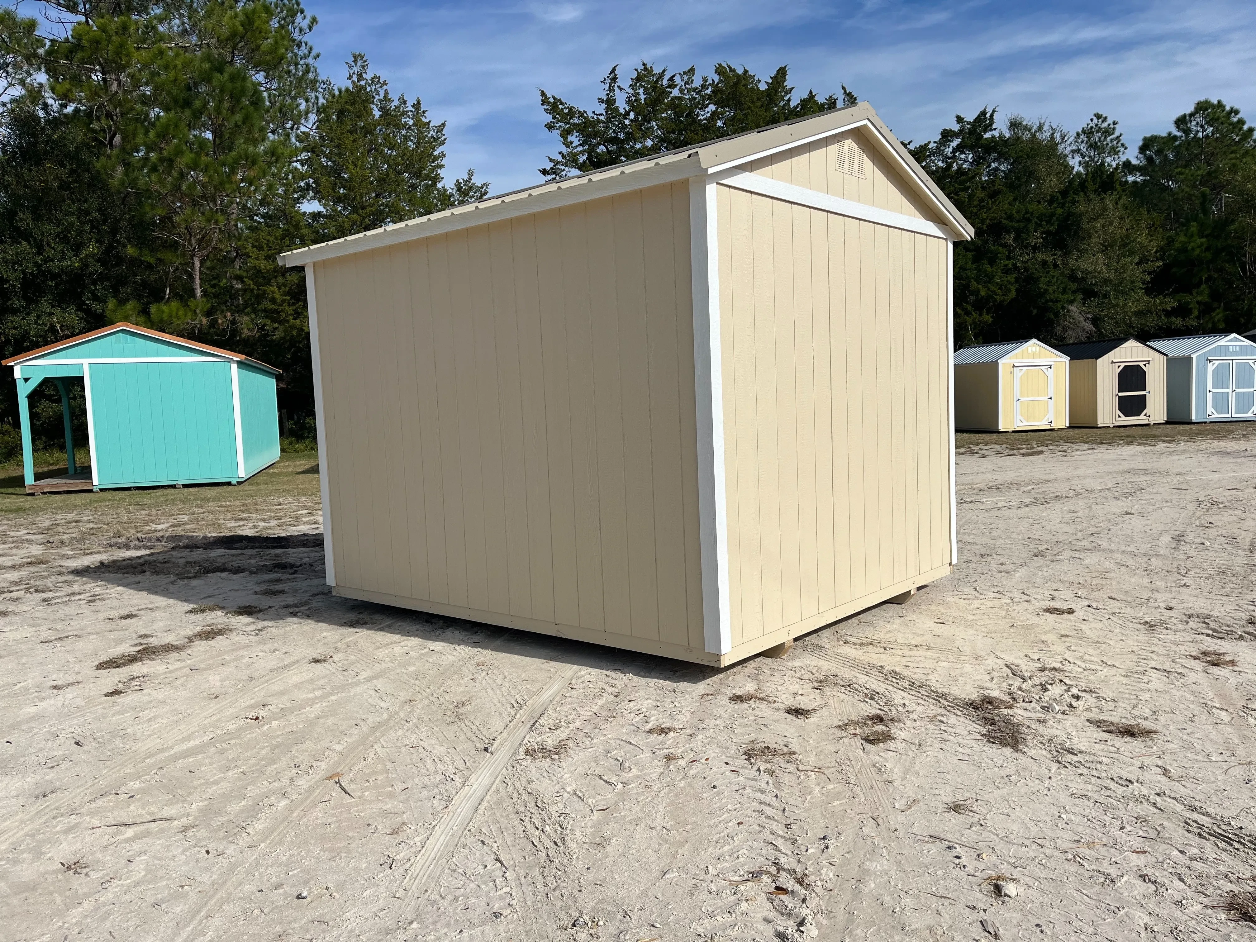 Exterior rear view of an almond and white 10x12 ide garden shed