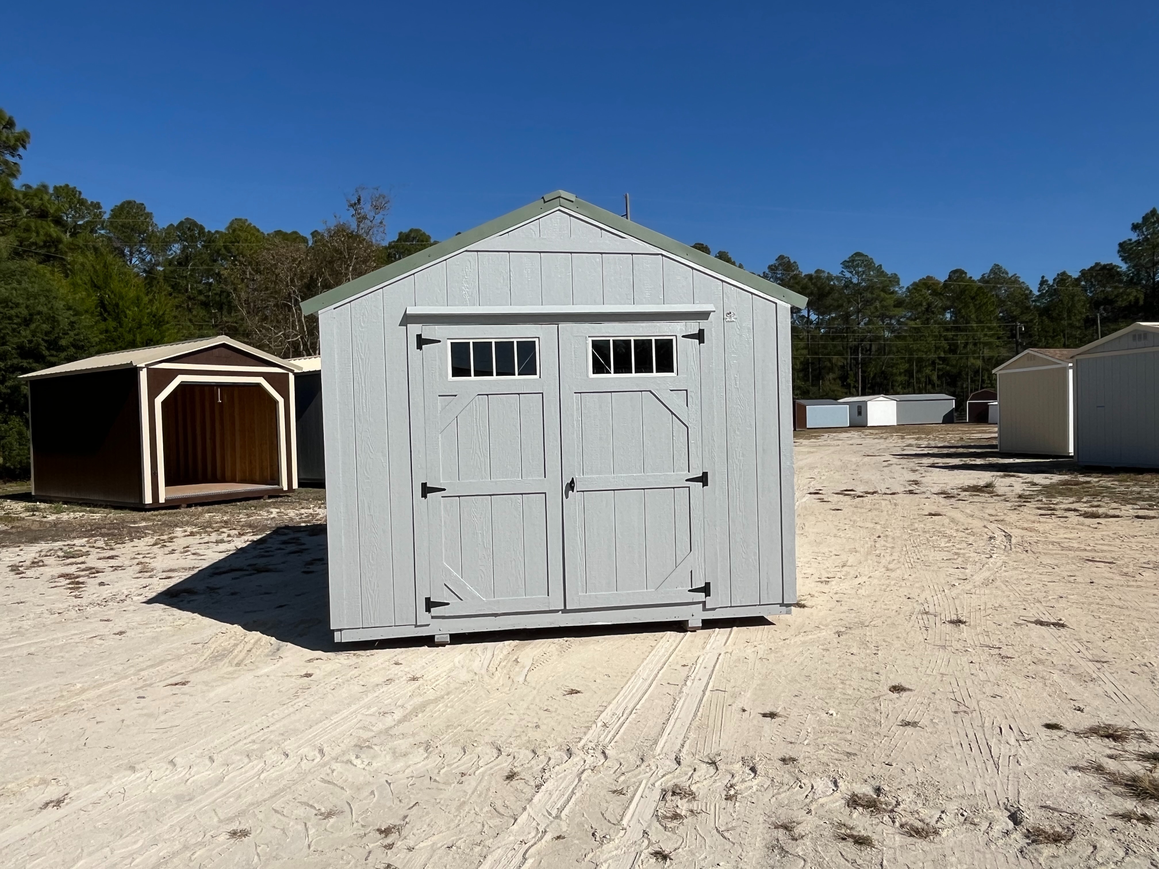 Front Exterior of a dark grey 10x16 Garden Shed Economy with double wood doors with windows