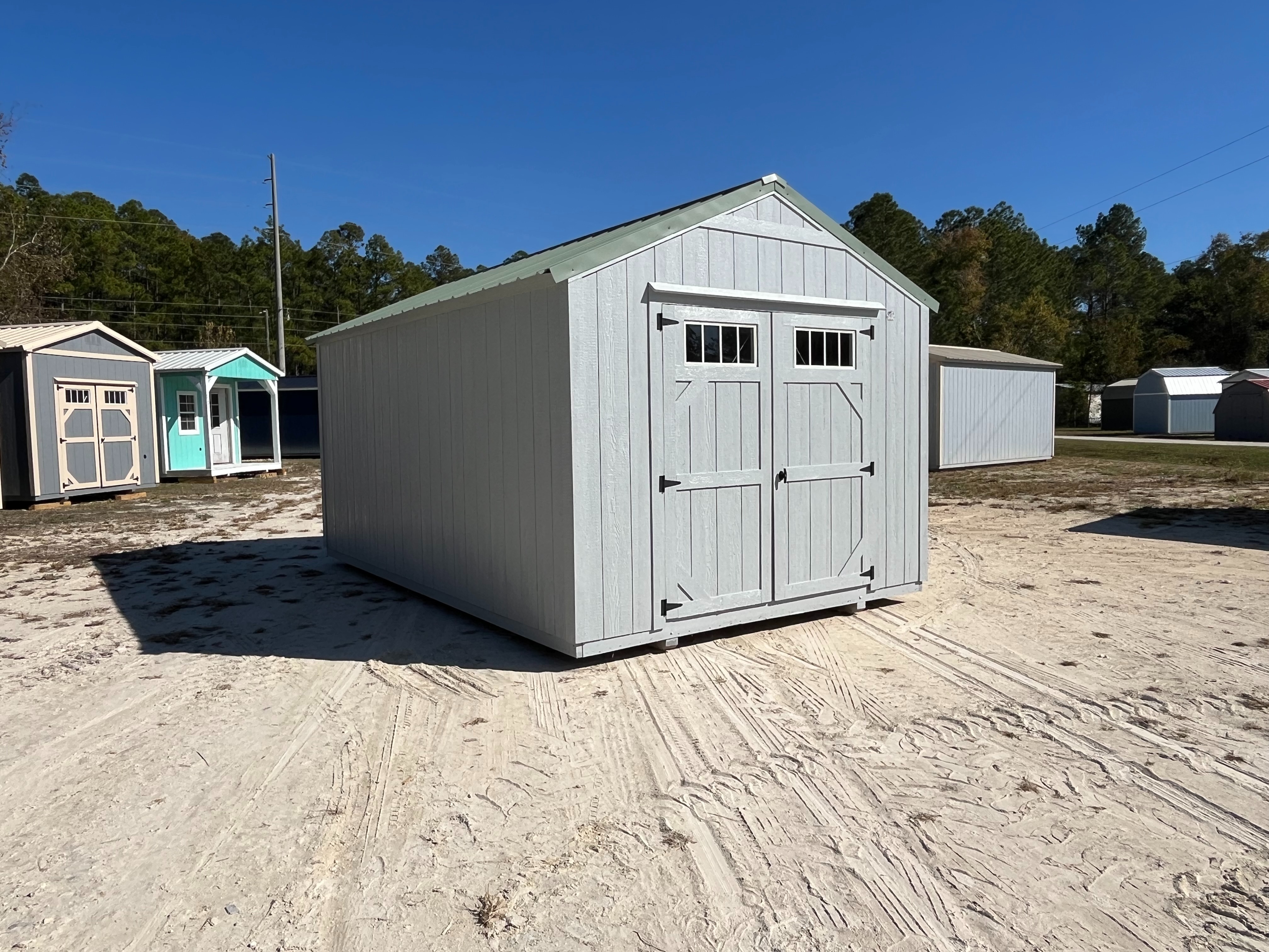 Front left Exterior of a dark grey 10x16 Garden Shed Economy with double wood doors with windows