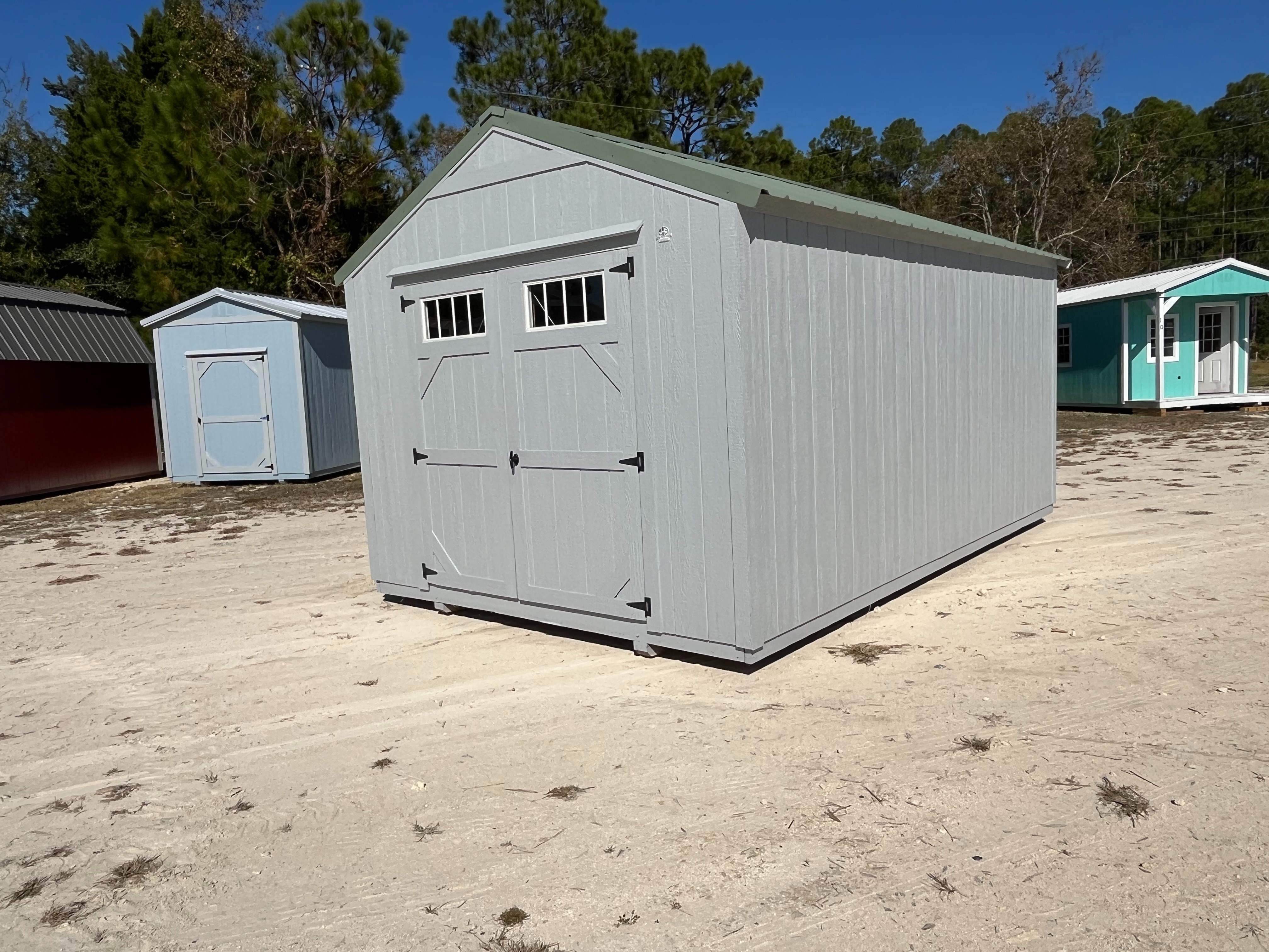 Front right Exterior of a dark grey 10x16 Garden Shed Economy with double wood doors with windows