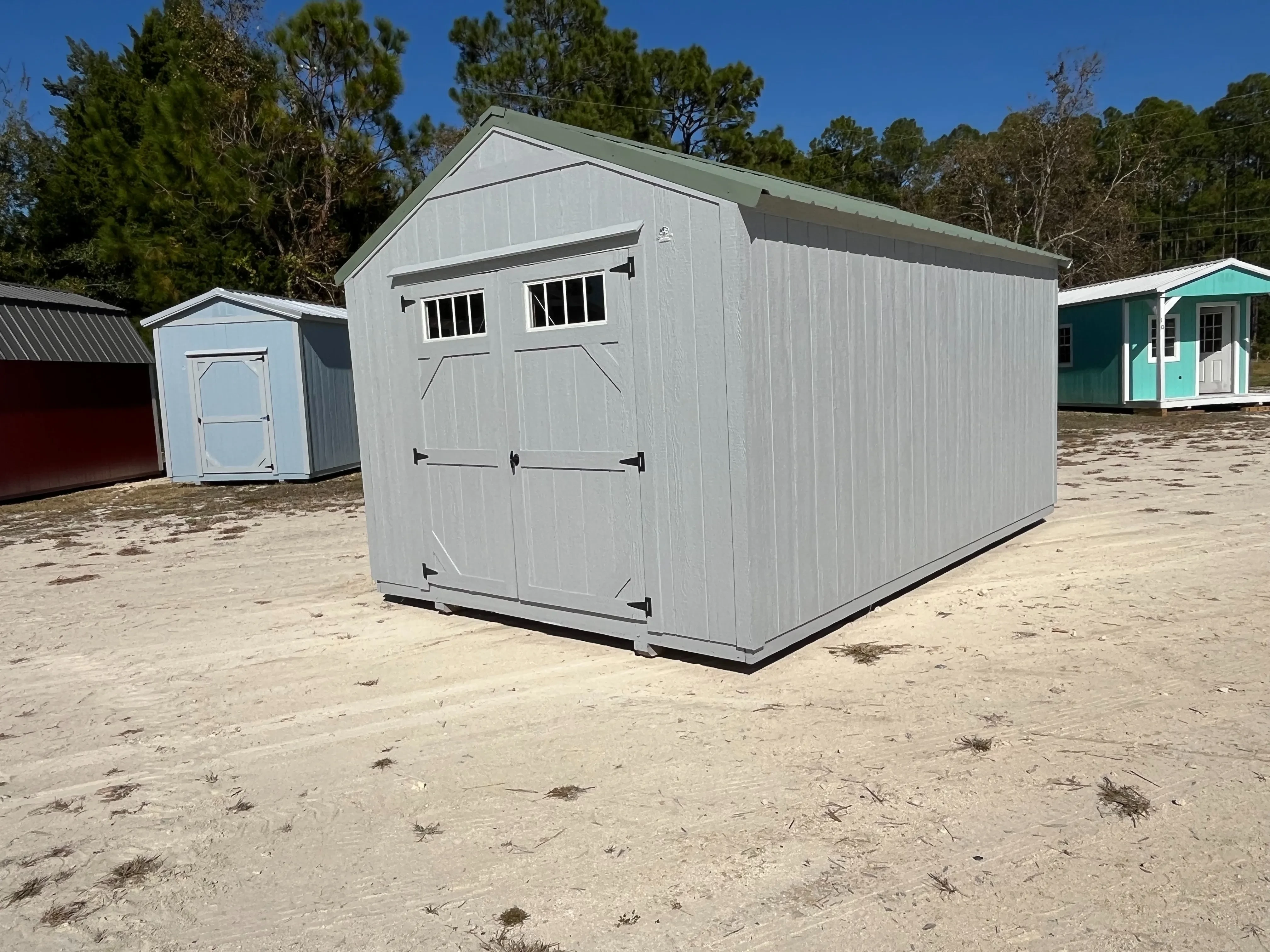Front right Exterior of a dark grey 10x16 Garden Shed Economy with double wood doors with windows