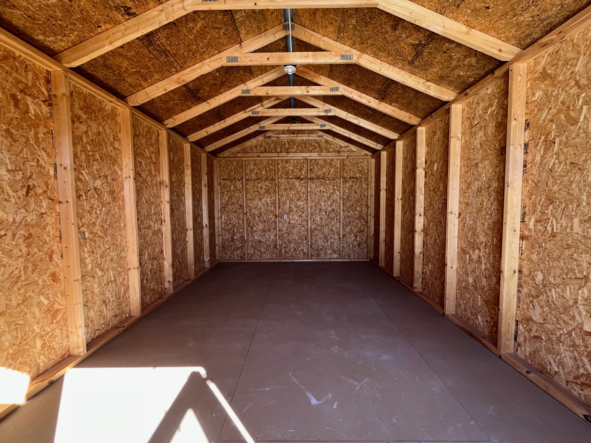 Interior of a 10x16 garden shed economy showing  through the doors