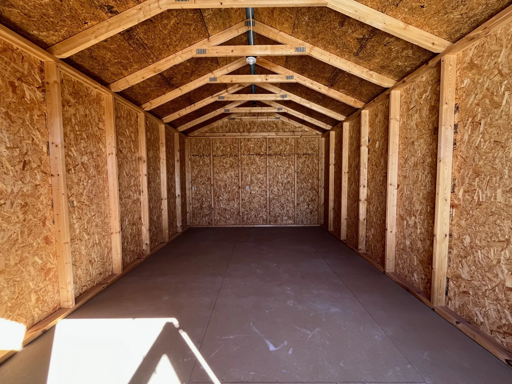Interior of a 10x16 garden shed economy showing through the doors