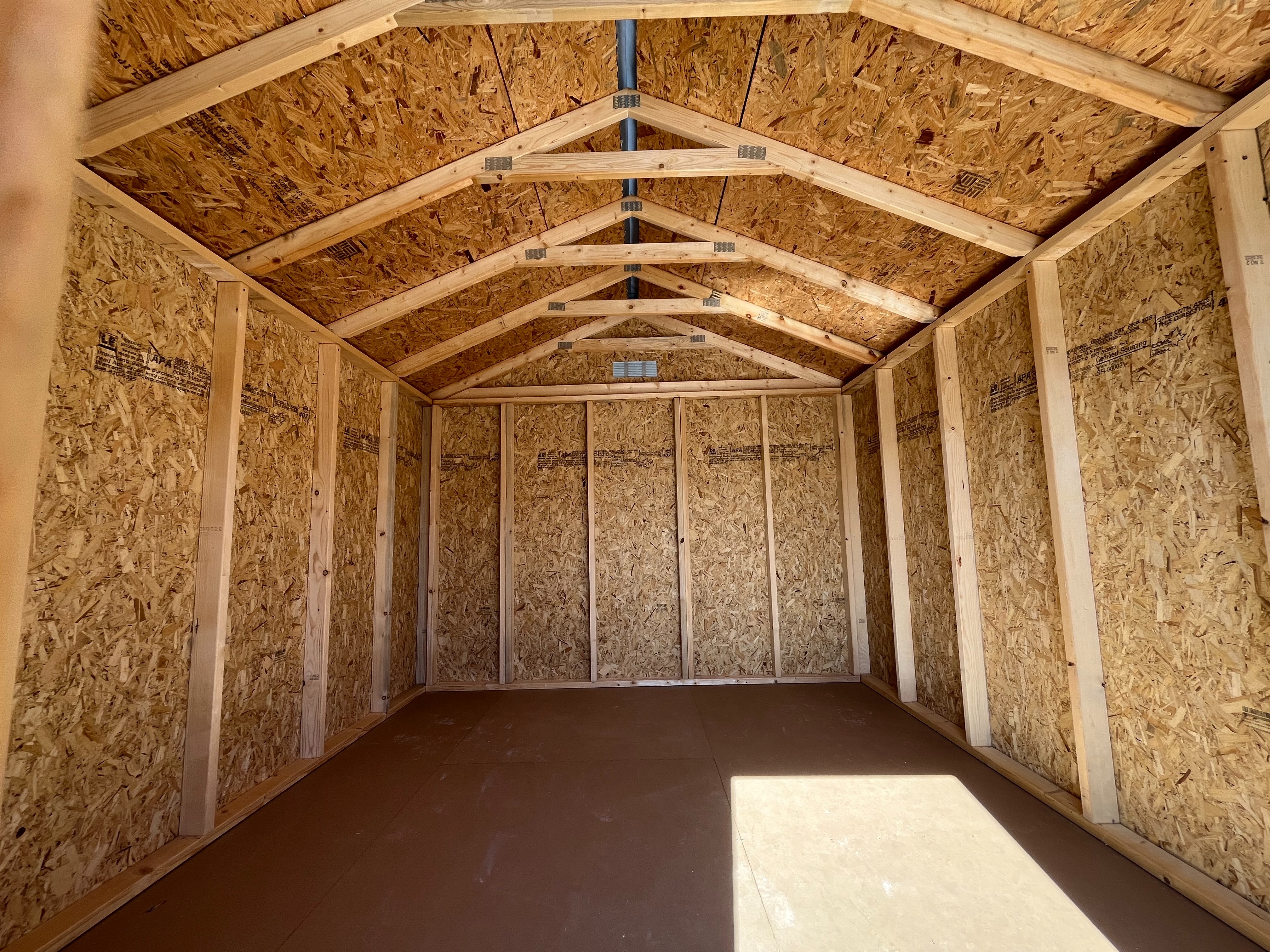 Interior of a 10x12 Garden Shed Economy showing through the wood door