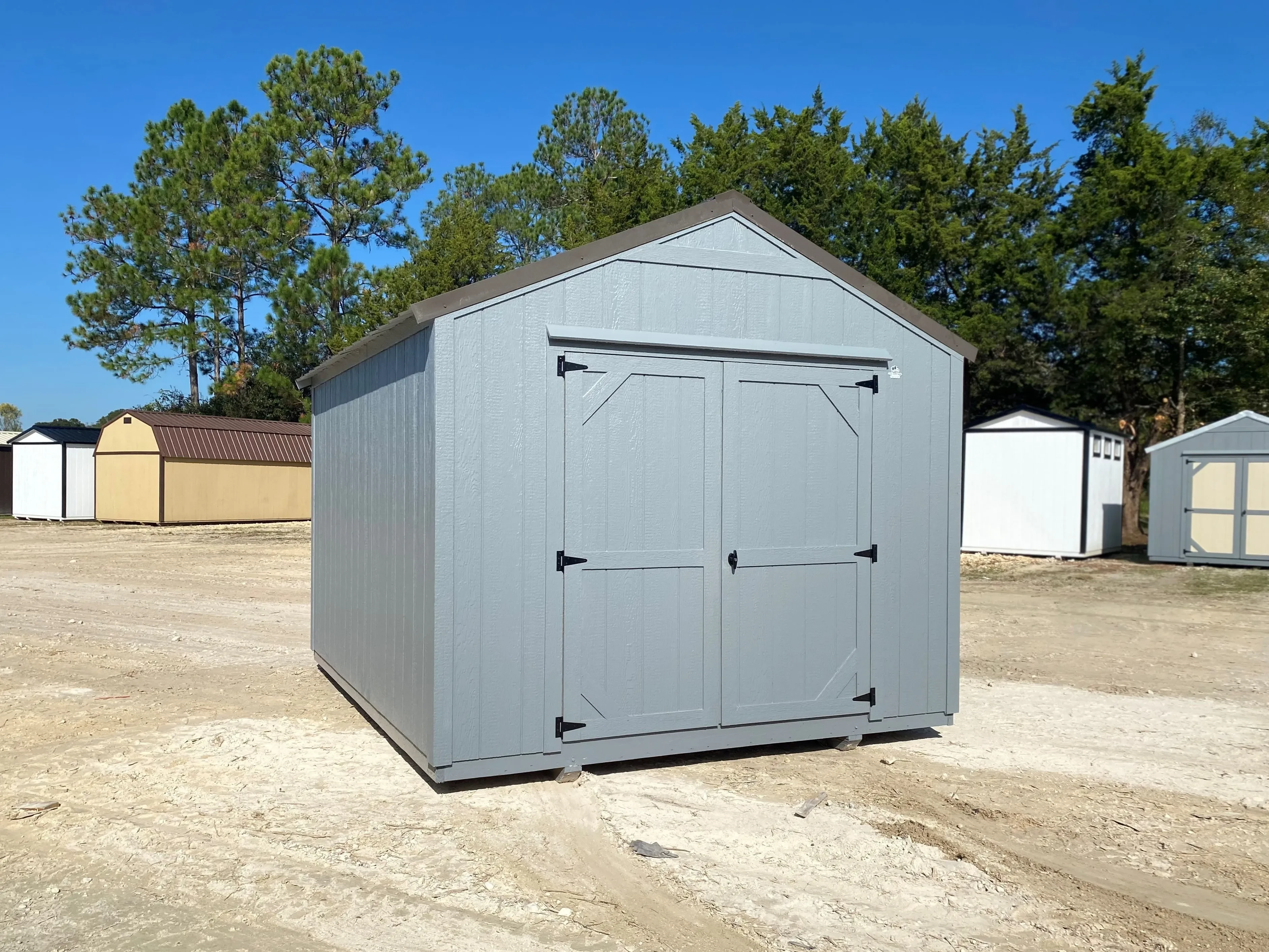 grey economy wood garden shed with a bronze roof