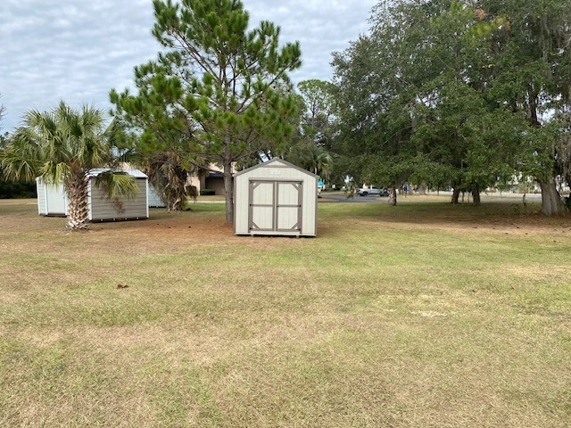 Exterior of a 10x12 clay in color garden shed economy with double wood doors