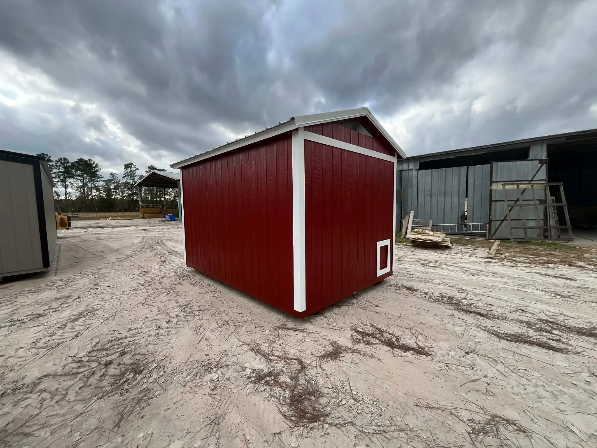 Exterior rear of a red 8x12 chicken coop
