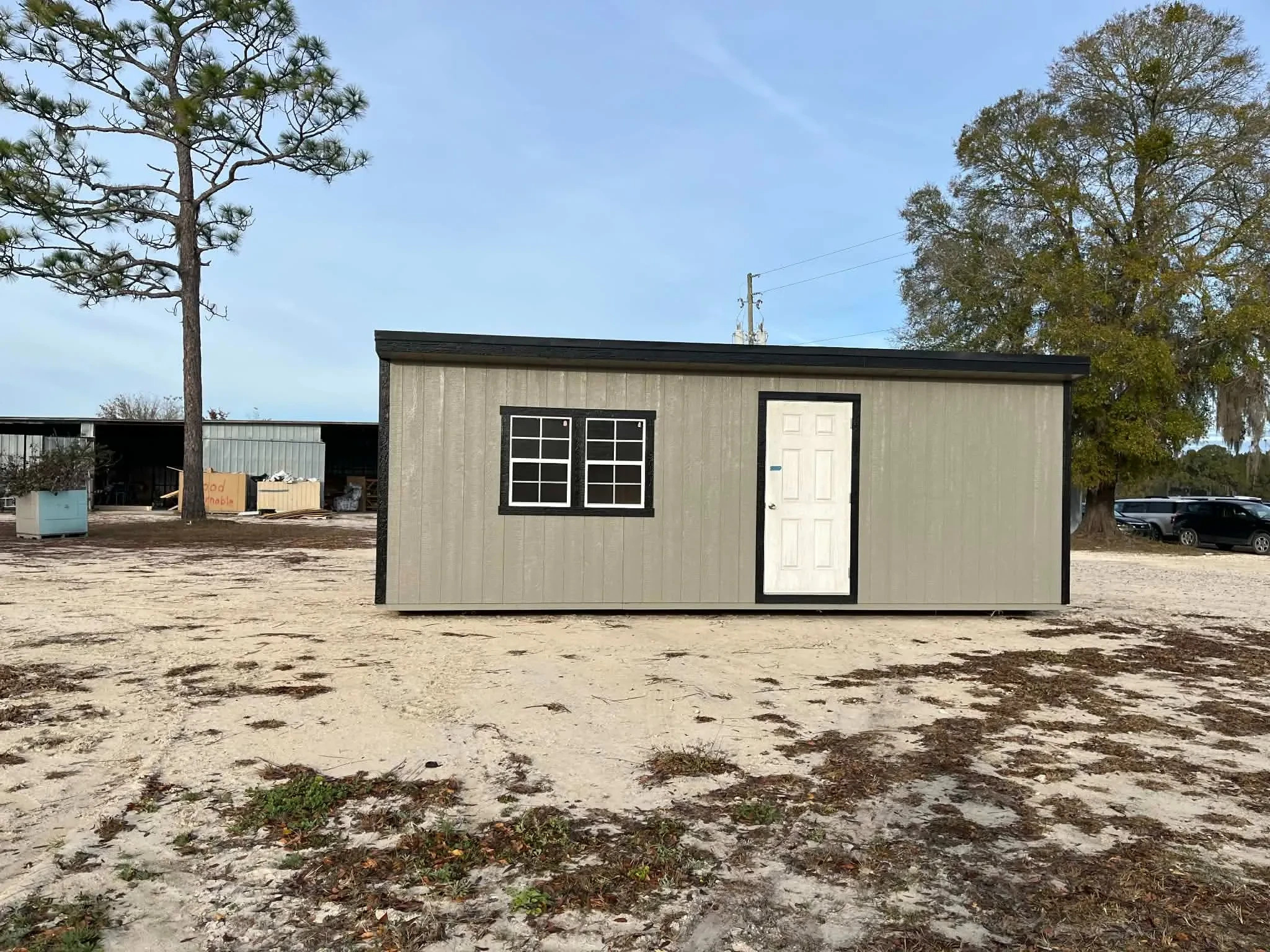 Exterior of a 10x24 clay in color Urban showing the walk-in door and windows