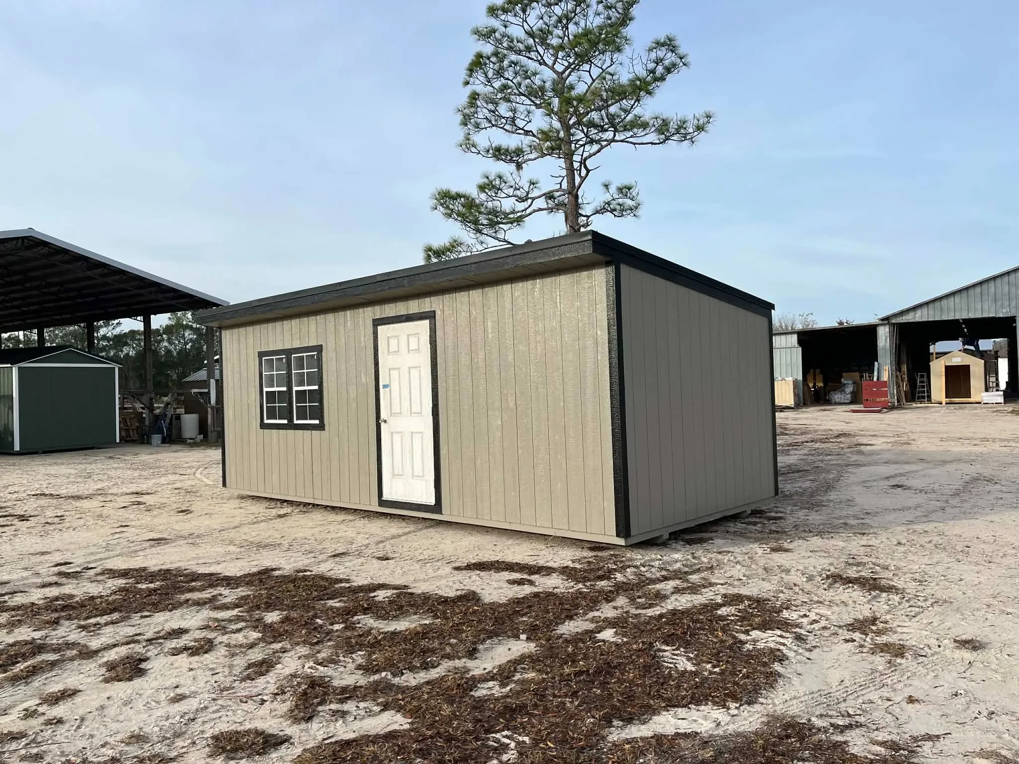 Exterior of a 10x24 clay in color Urban showing the walk-in door and windows