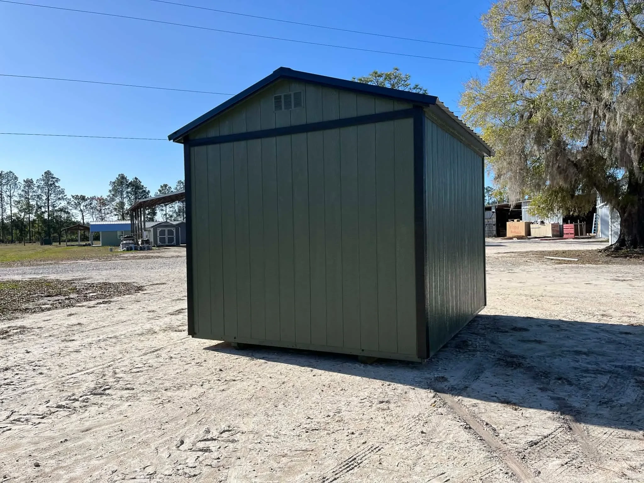 Exterior rear view of a green 10x12 side garden shed