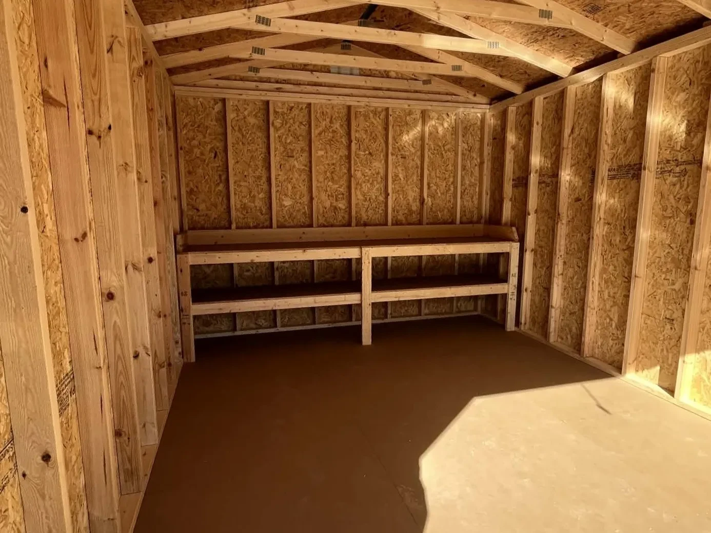 Interior of a 12x16 workshop showing the workbench