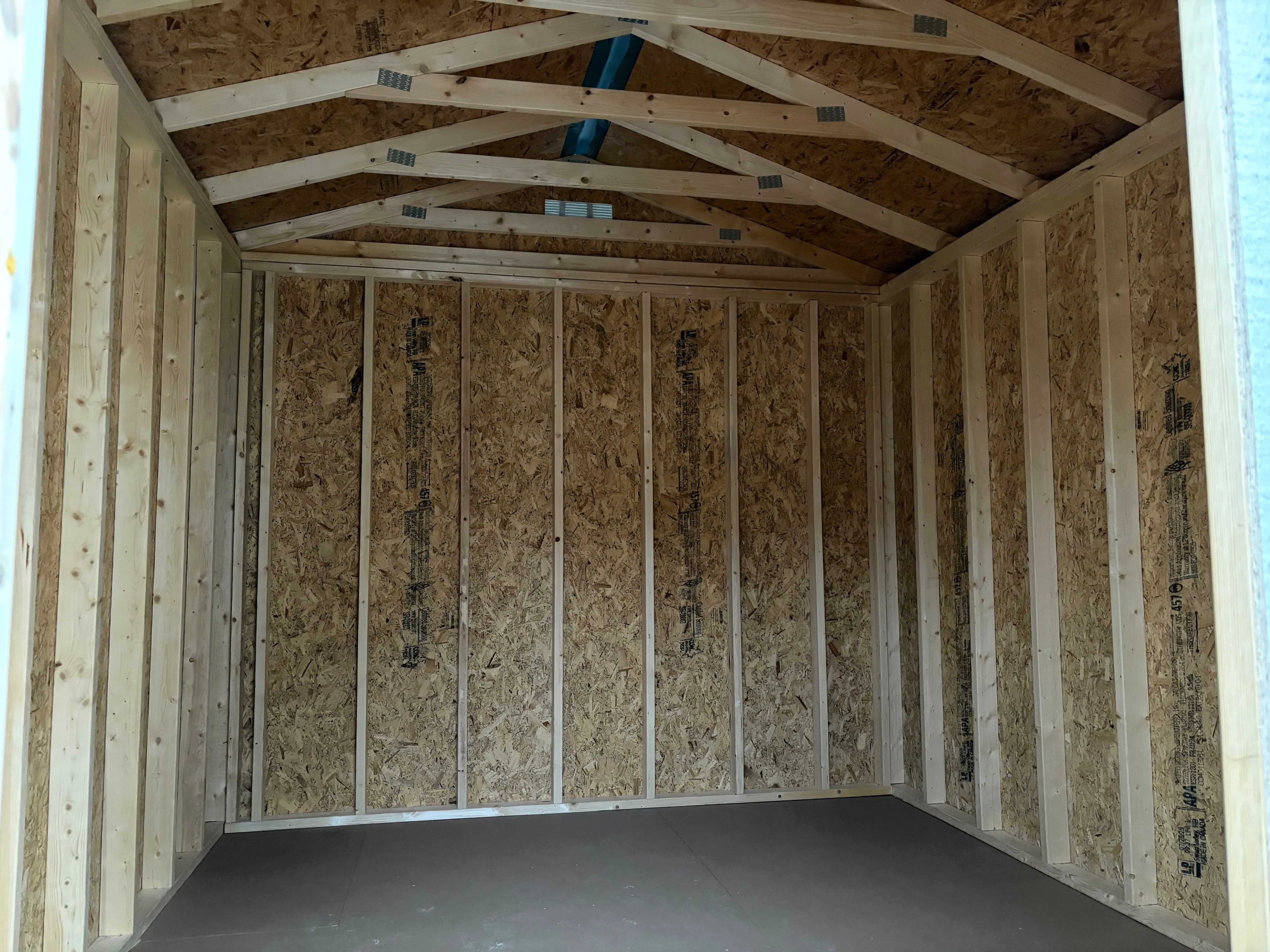 Interior of a garden shed with a vent in gable