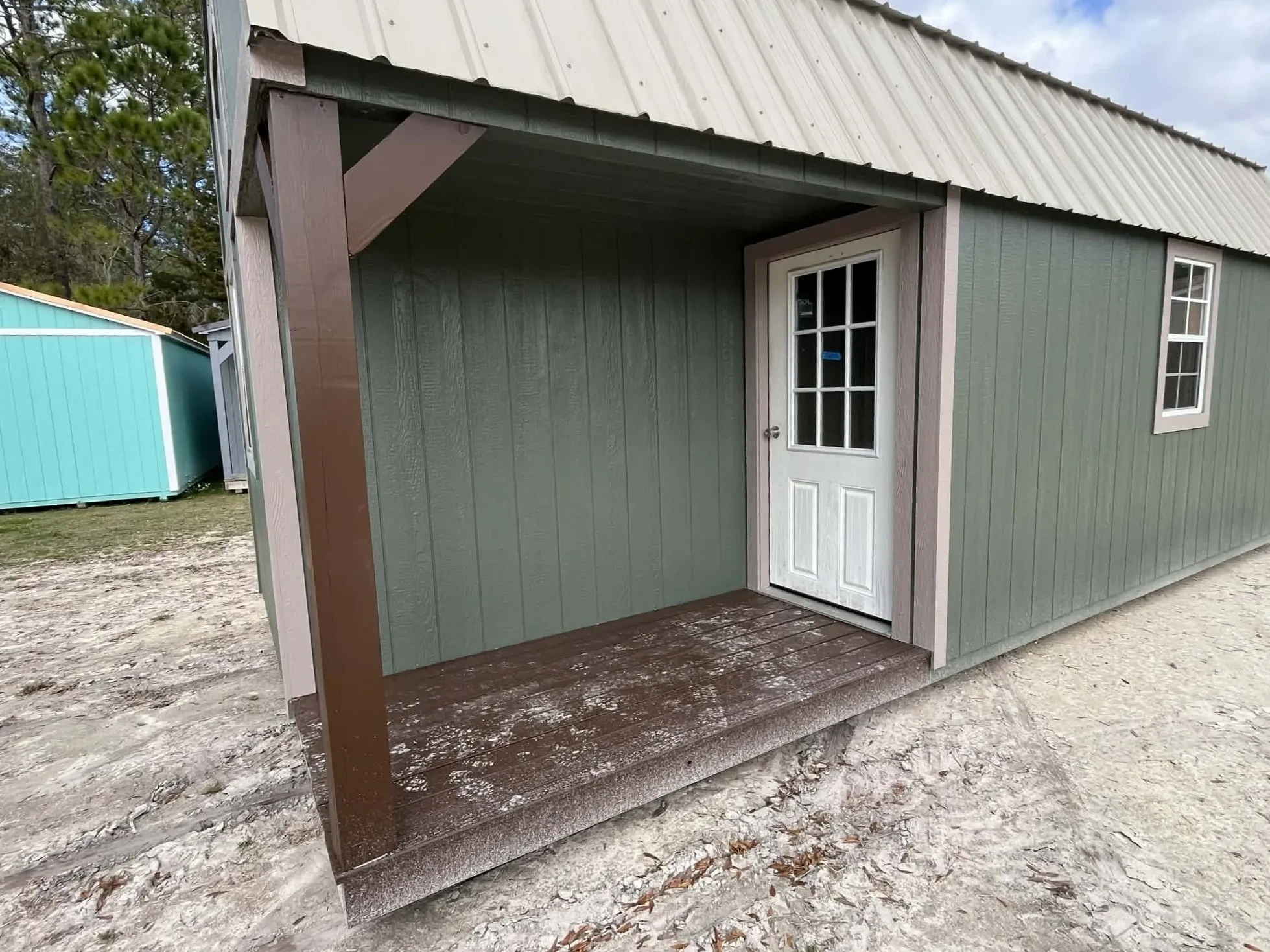 Porch area of a 12x24 lofted corner porch cabin
