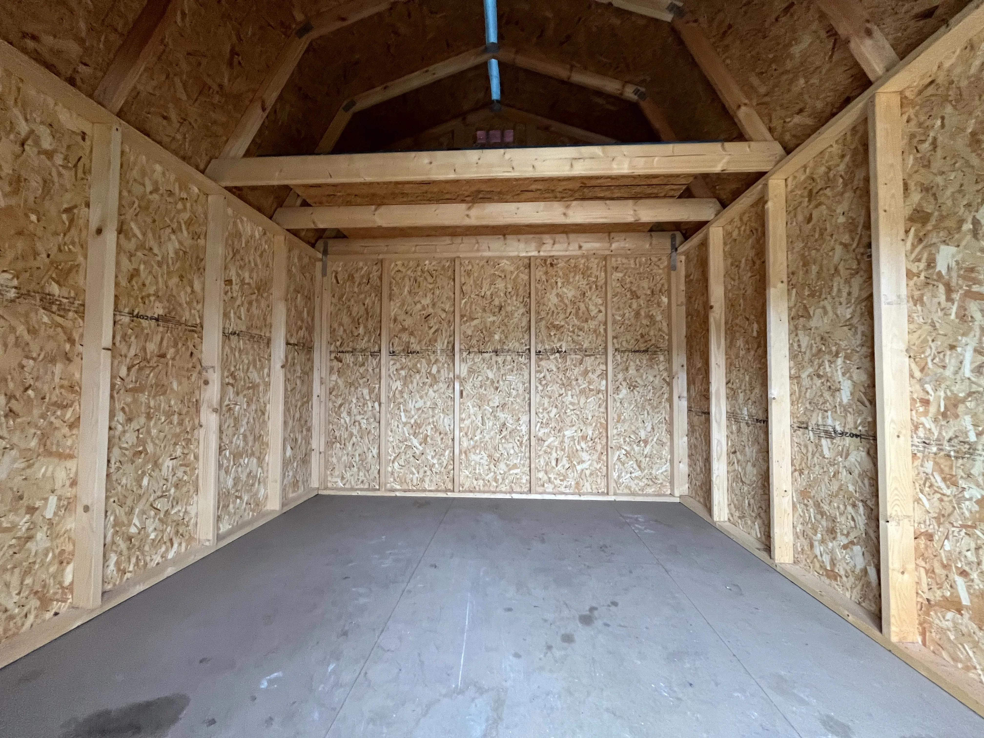 Interior of a 10x12 lofted barn economy showing the loft