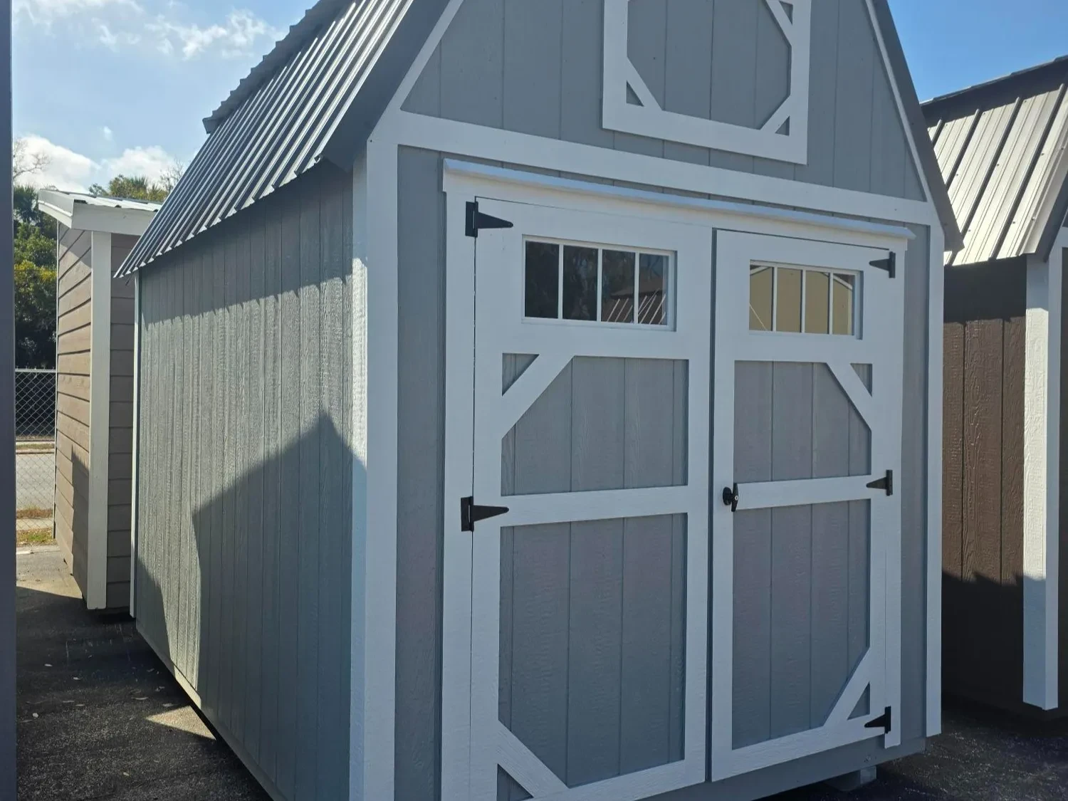 Exterior of 8x12 Lofted barn with 6' Barn doors with transom windows