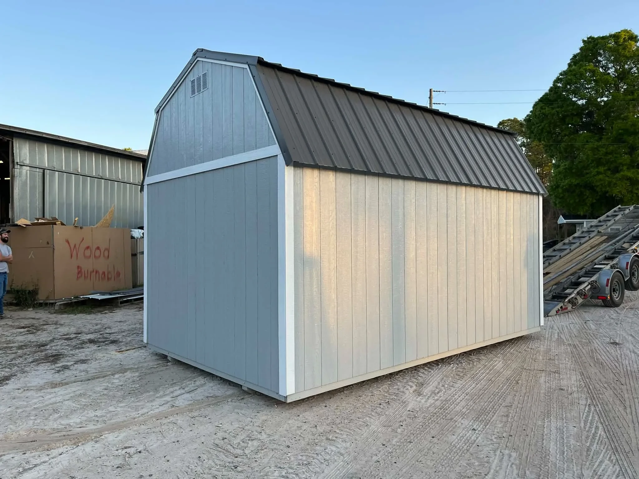 Exterior rear view of a grey 10x16 side lofted barn