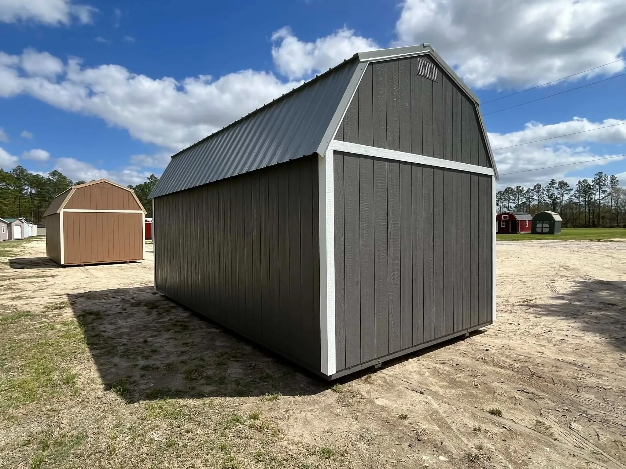 Exterior rear view of a dark grey 10x20 side lofted barn