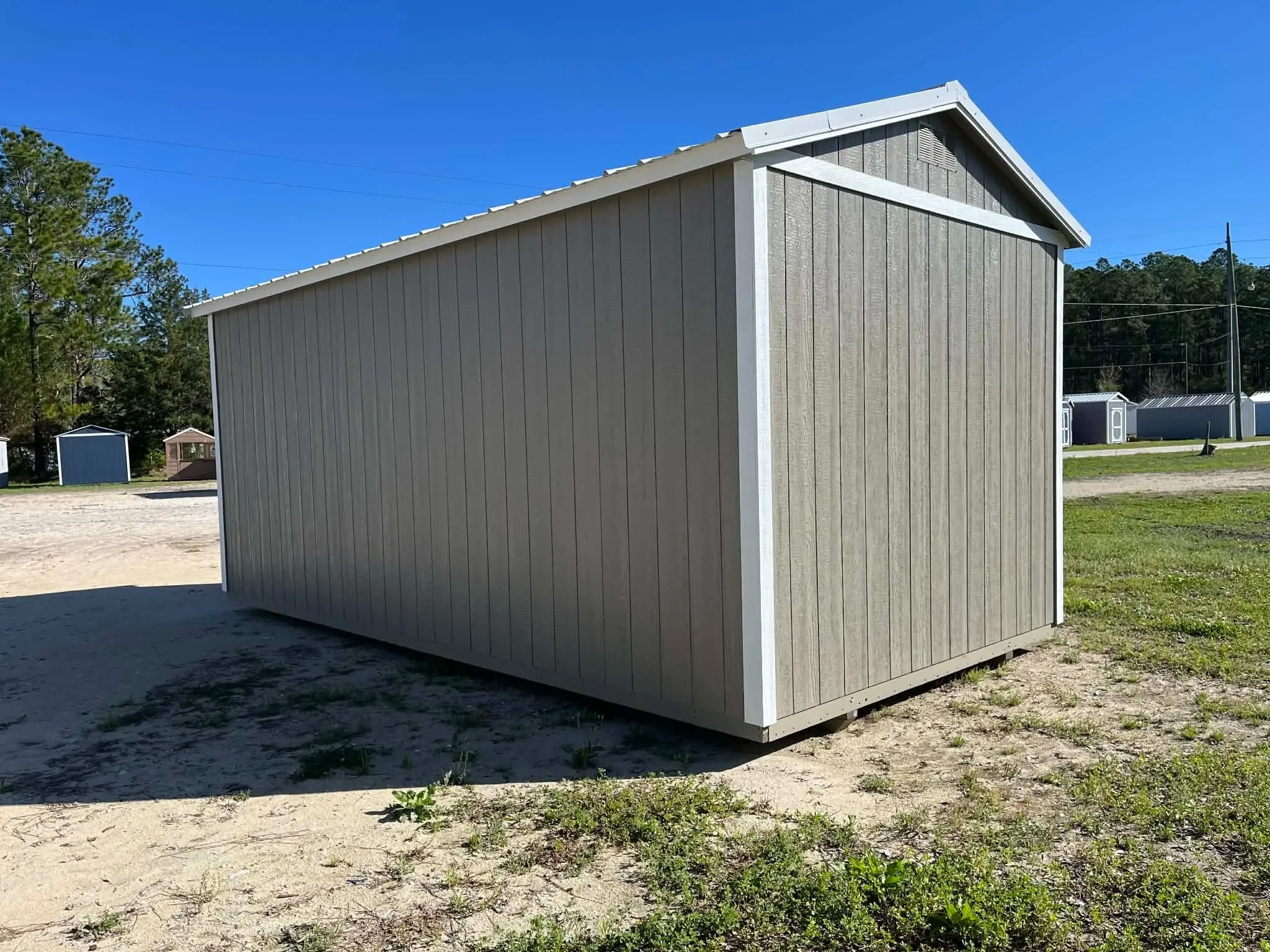 Exterior rear view of a clay color 10x20 side garden shed