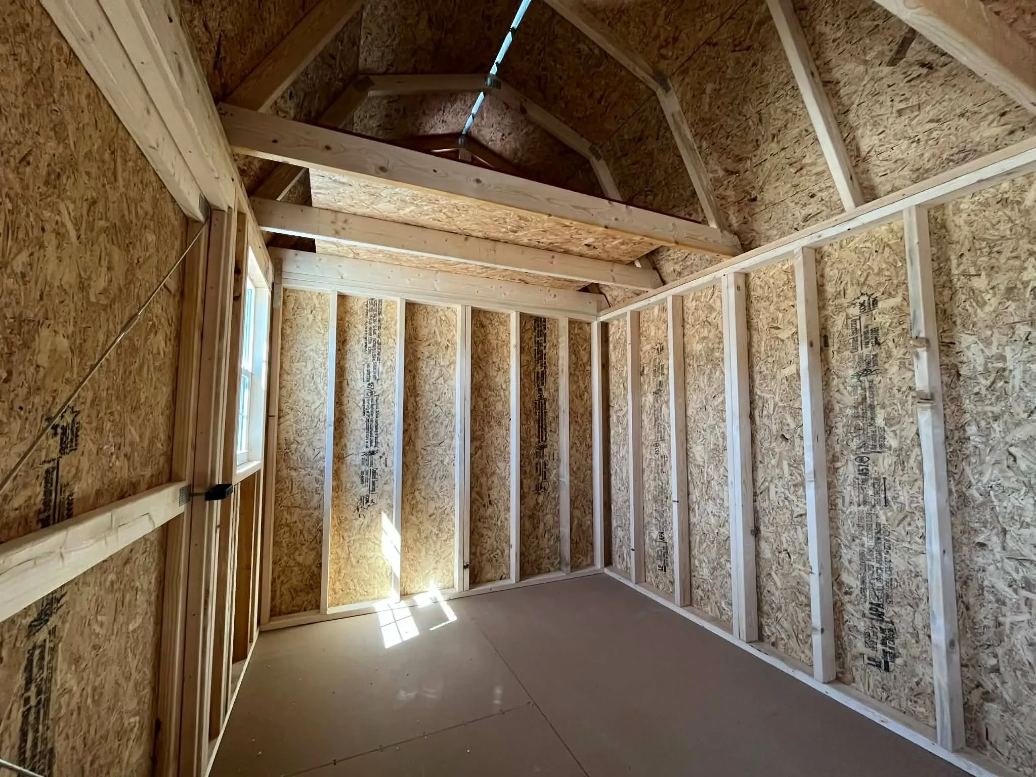 Interior view of an 8x12 side lofted barn showing the loft