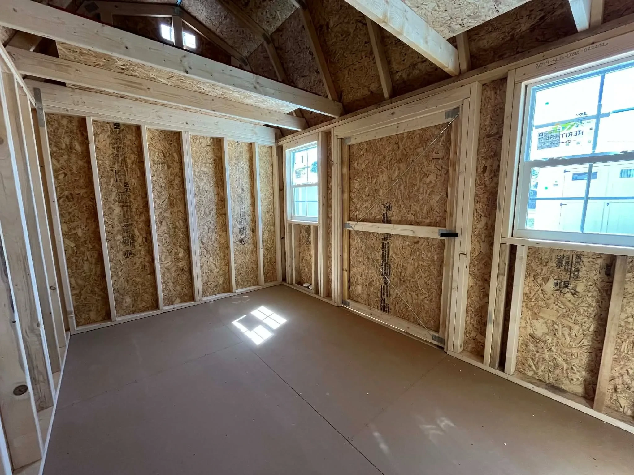 Interior view of an 8x12 side lofted barn showing the loft. door and windows