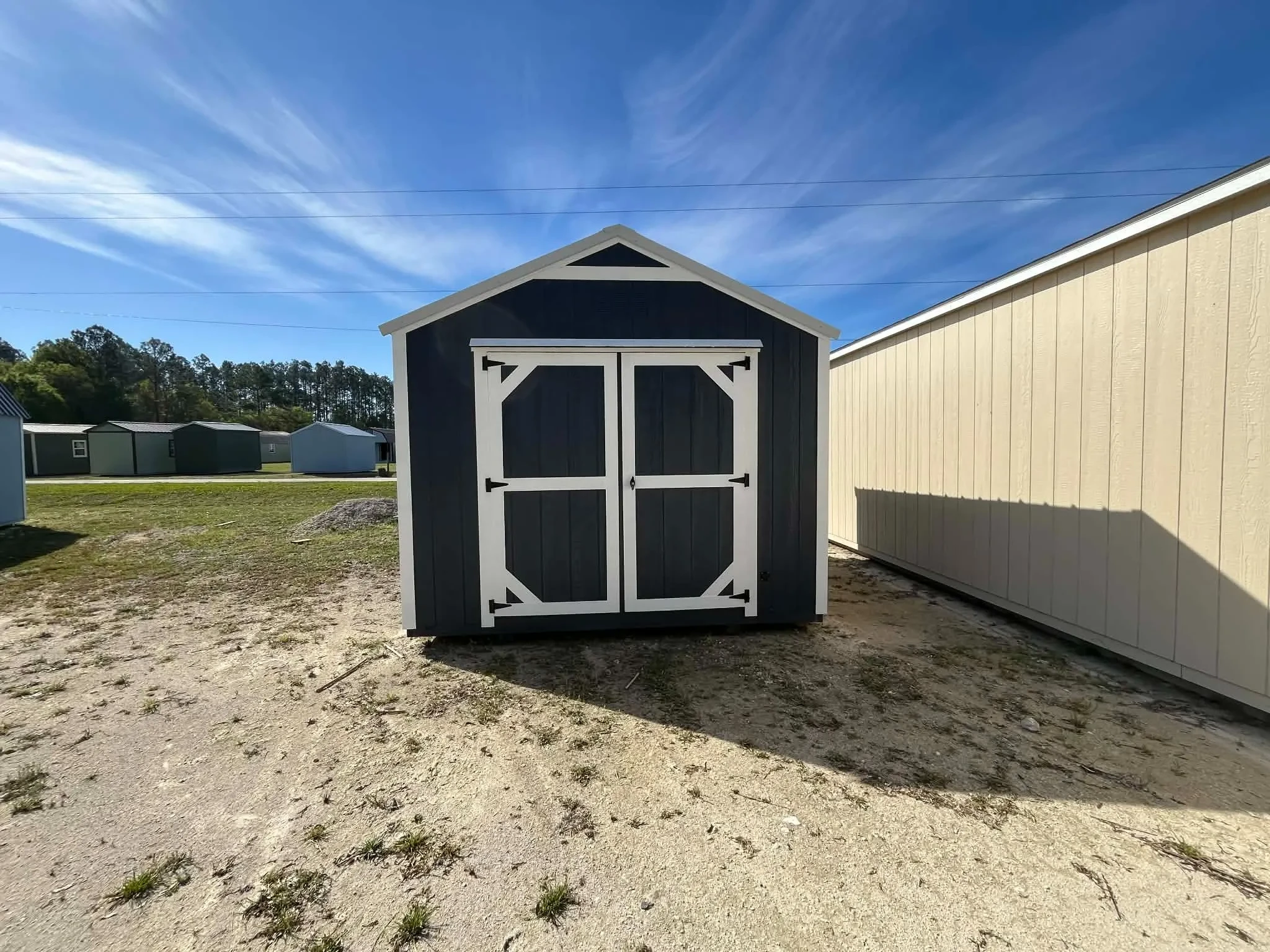 Exterior view of a 10x12 garden shed economy showing the wood doors