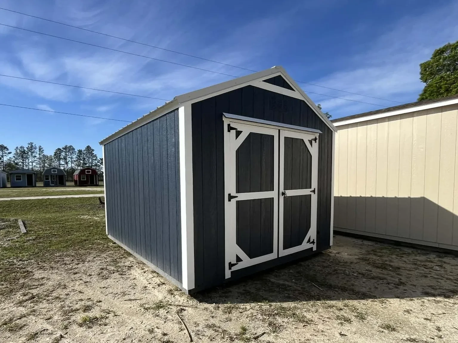 Exterior view of a 10x12 garden shed economy showing the wood doors
