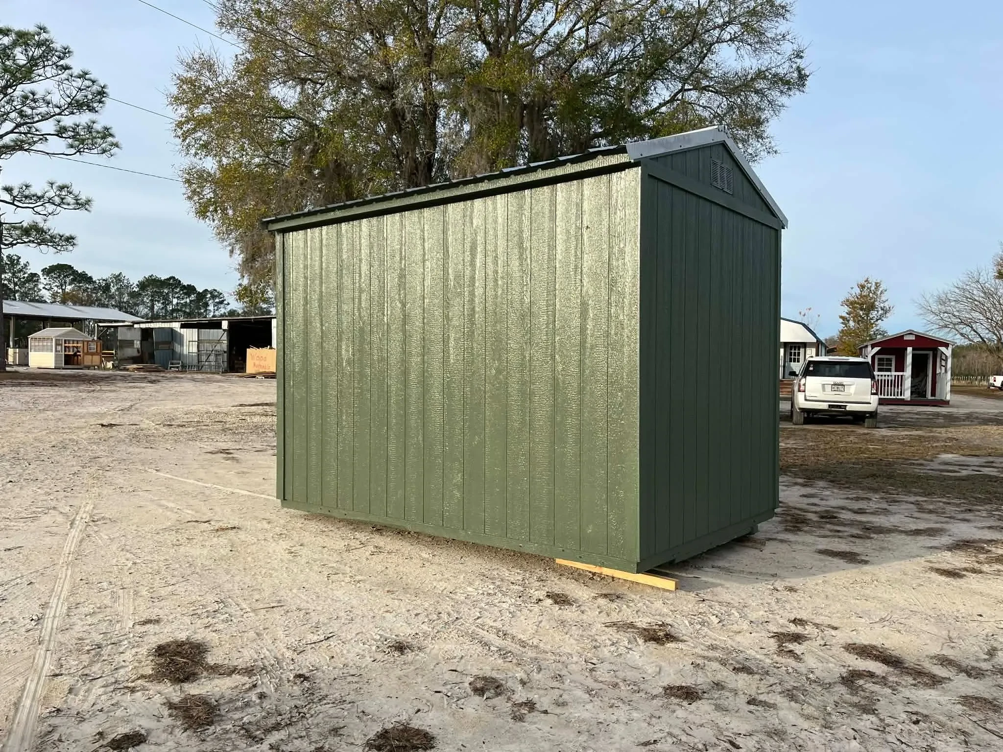 Exterior rear view of a green 8x12 garden shed