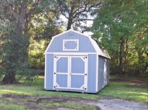 light blue lofted barn with double doors in the end