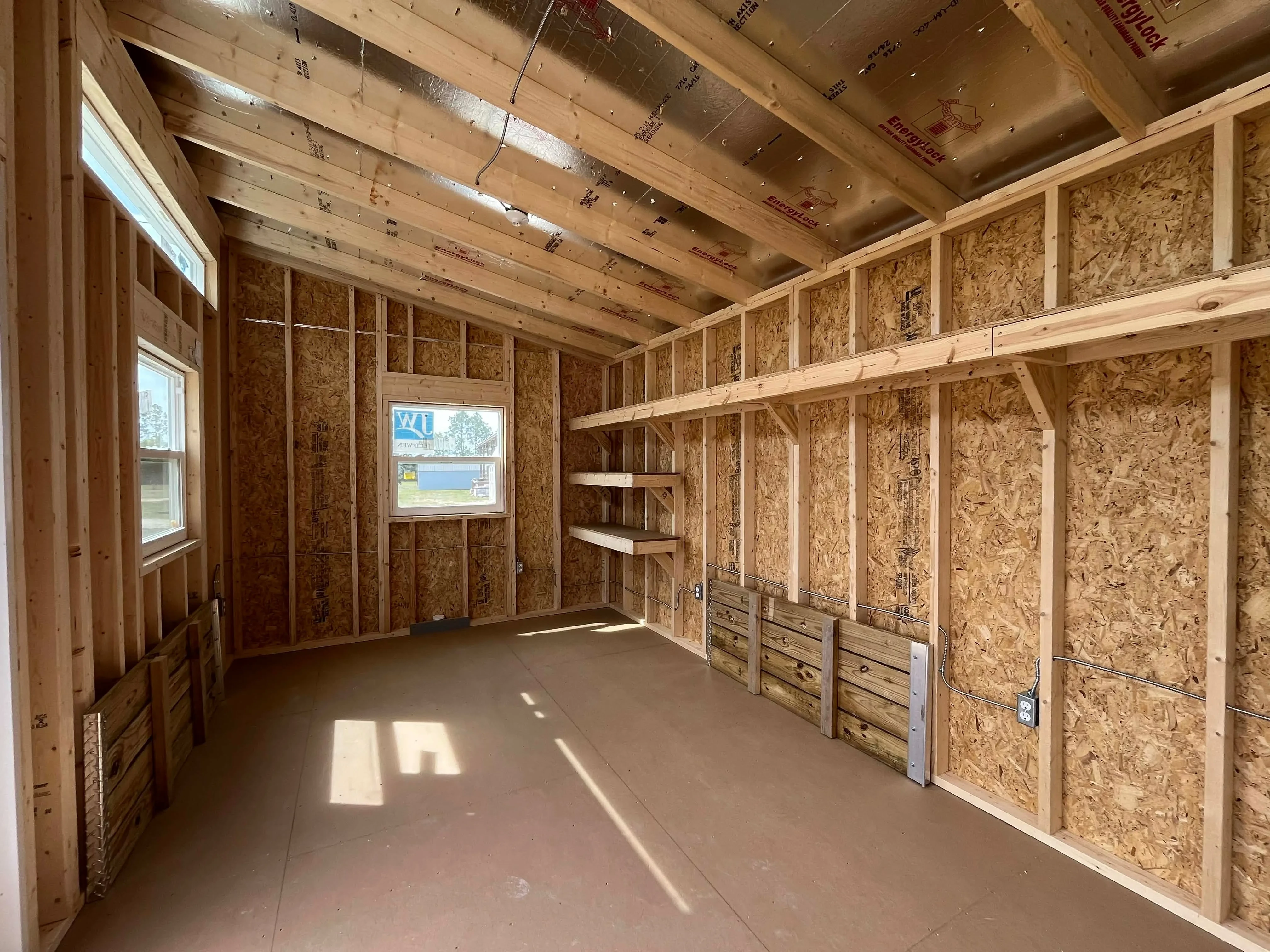 Interior view of a 10x24 urban showing the shelving and electric
