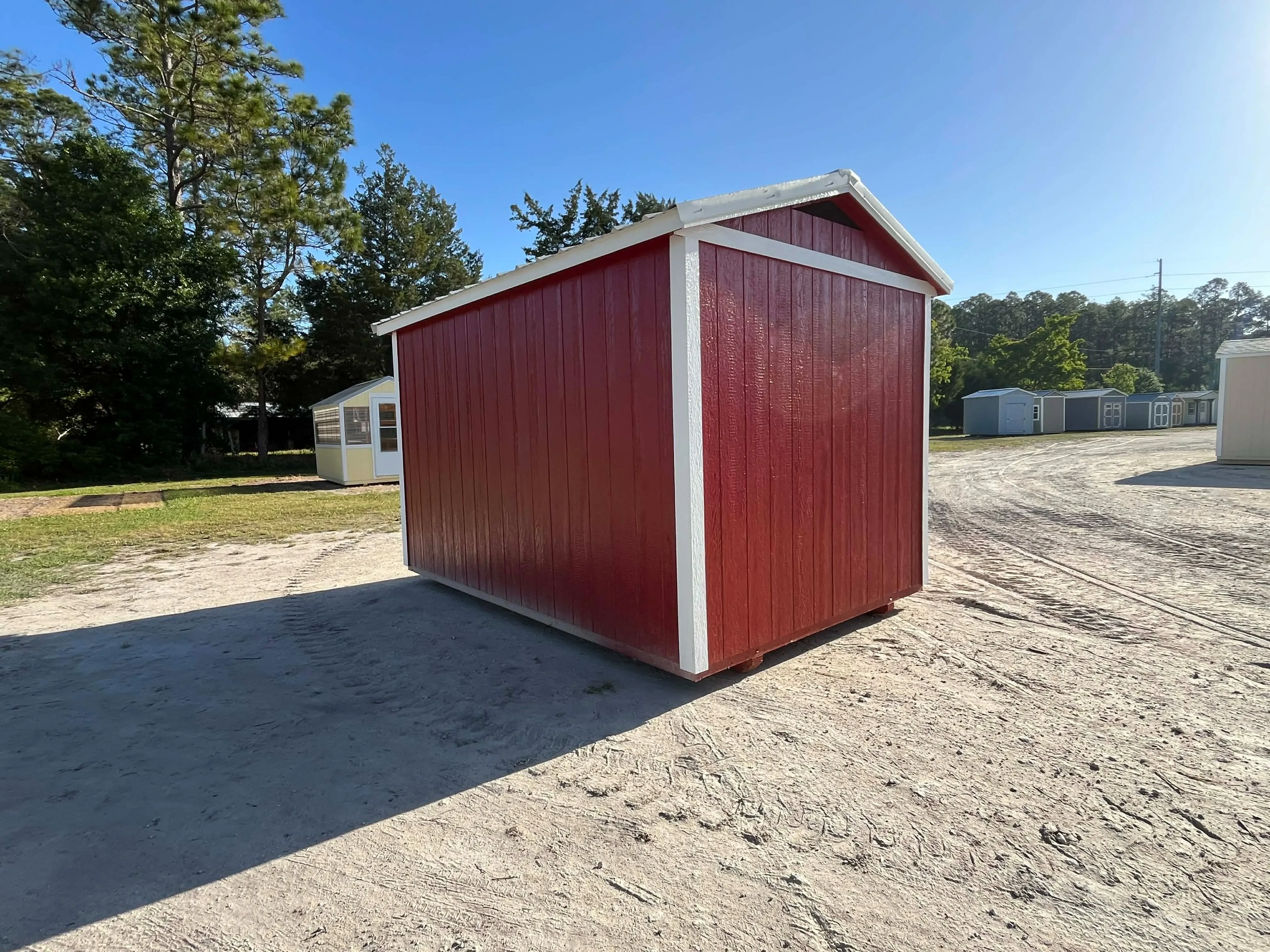 Exterior rear view of a red 8x12 chicken coop
