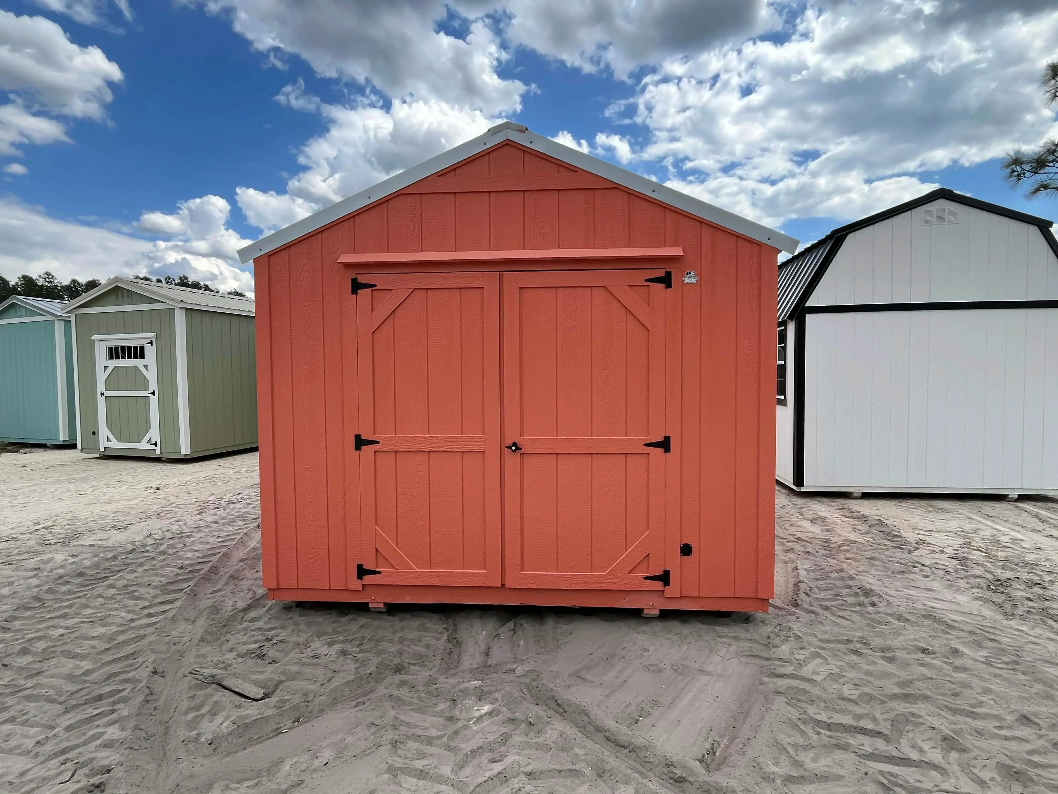 Exterior front view of a 10x12 garden shed economy showing the double wood doors